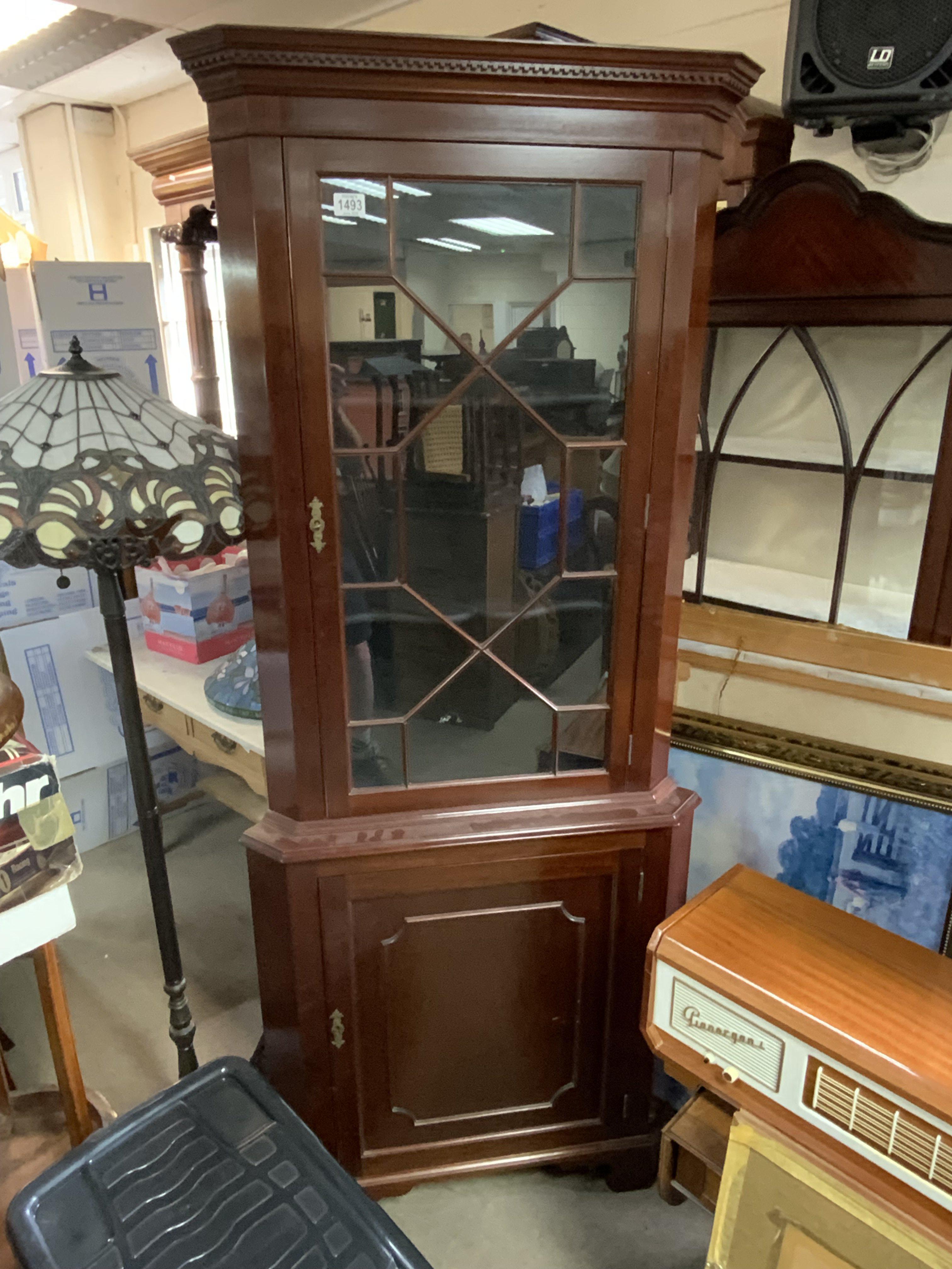 a mahogany corner display unit.