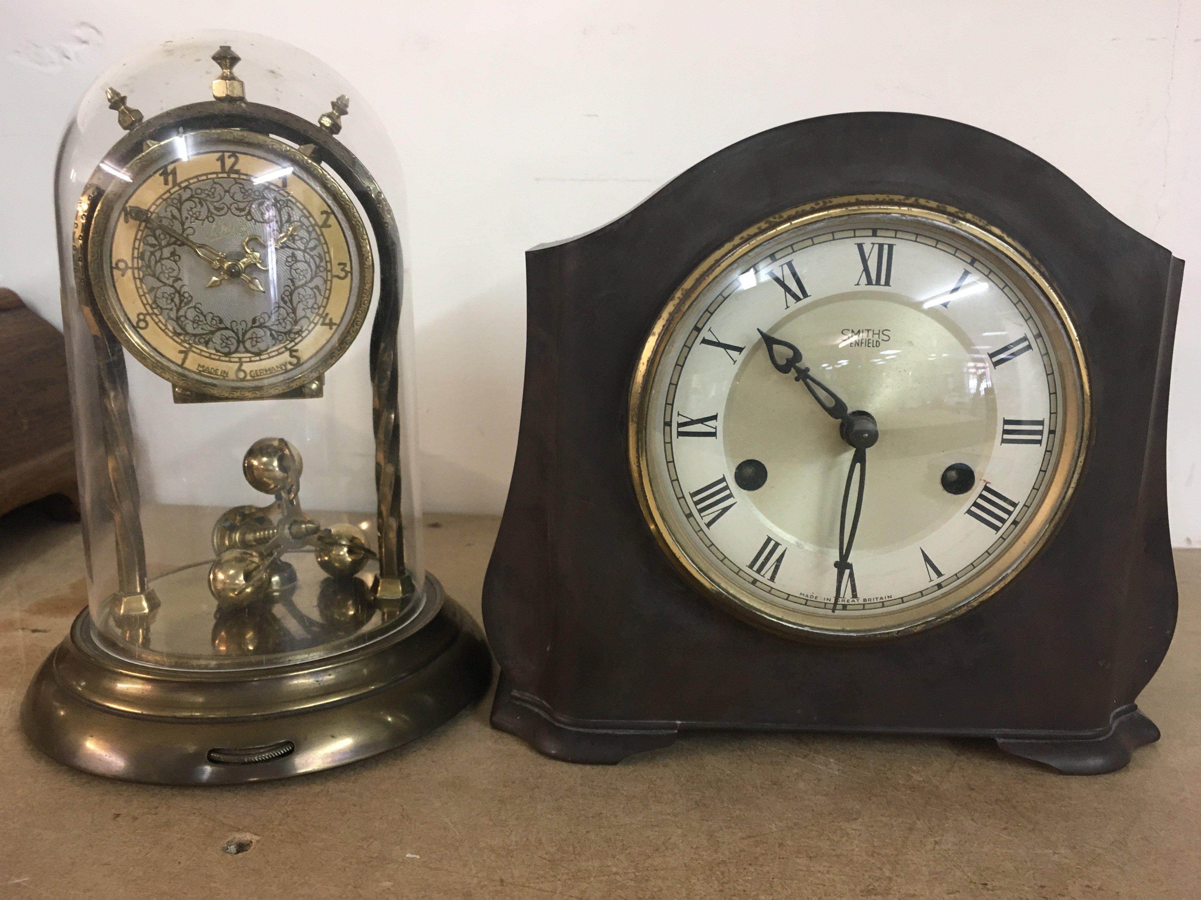 A anniversary clock and a smiths mantal clock .