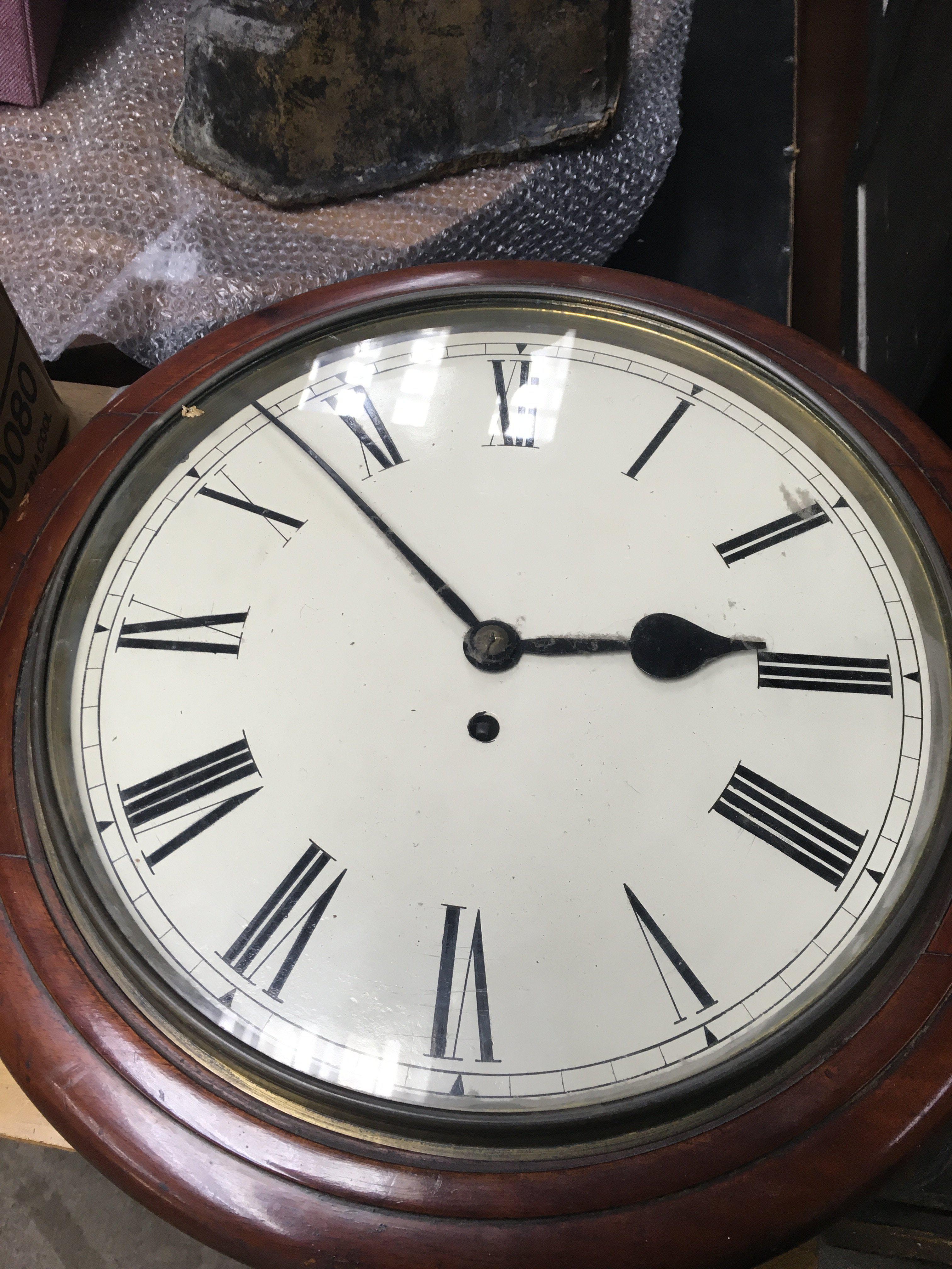 A Mahogany drop dial wall clock the painted dial with Roman numerals Fitted with a fusee dial.