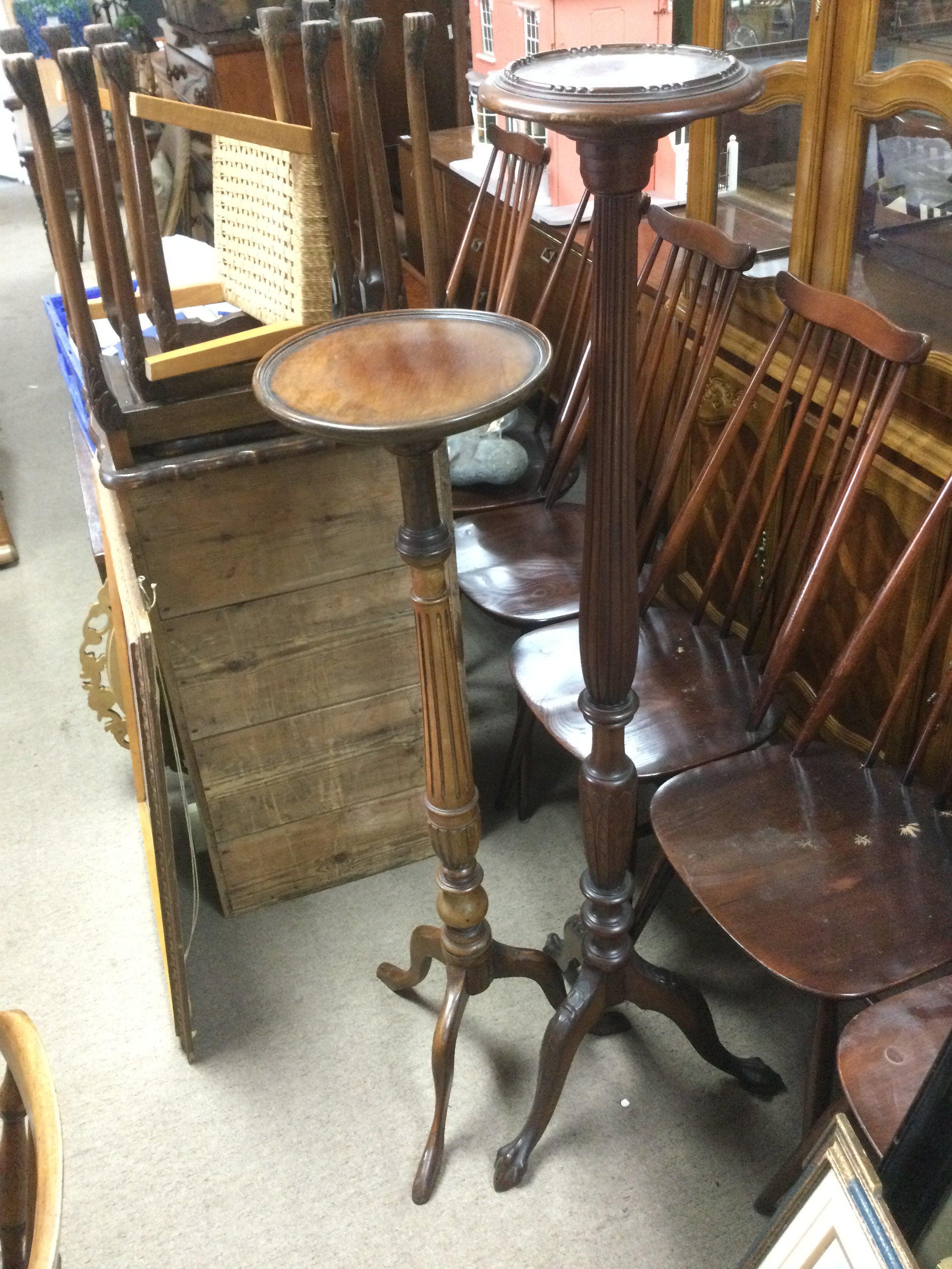 An oak plant stand and one other (2). Shipping category D.