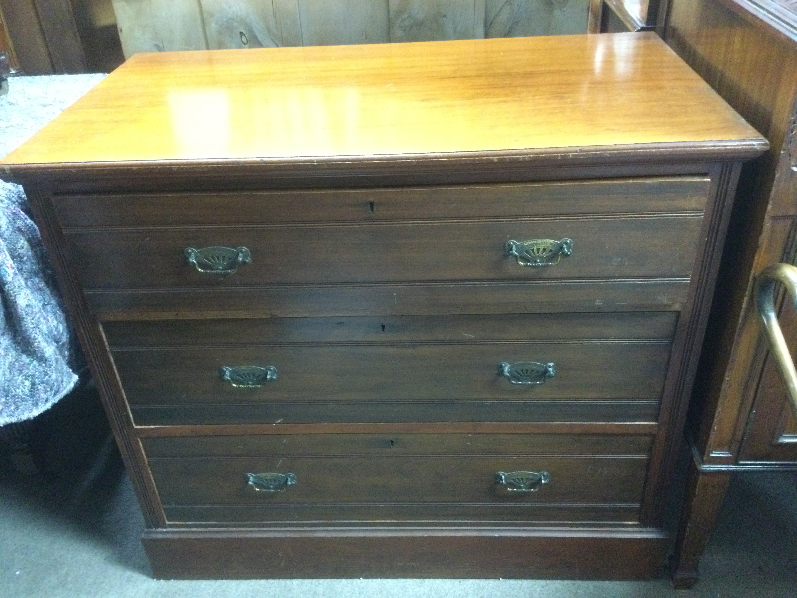 An Edwardian walnut chest of drawers, approx 91cm x 51cm x 81cm . Shipping category D.