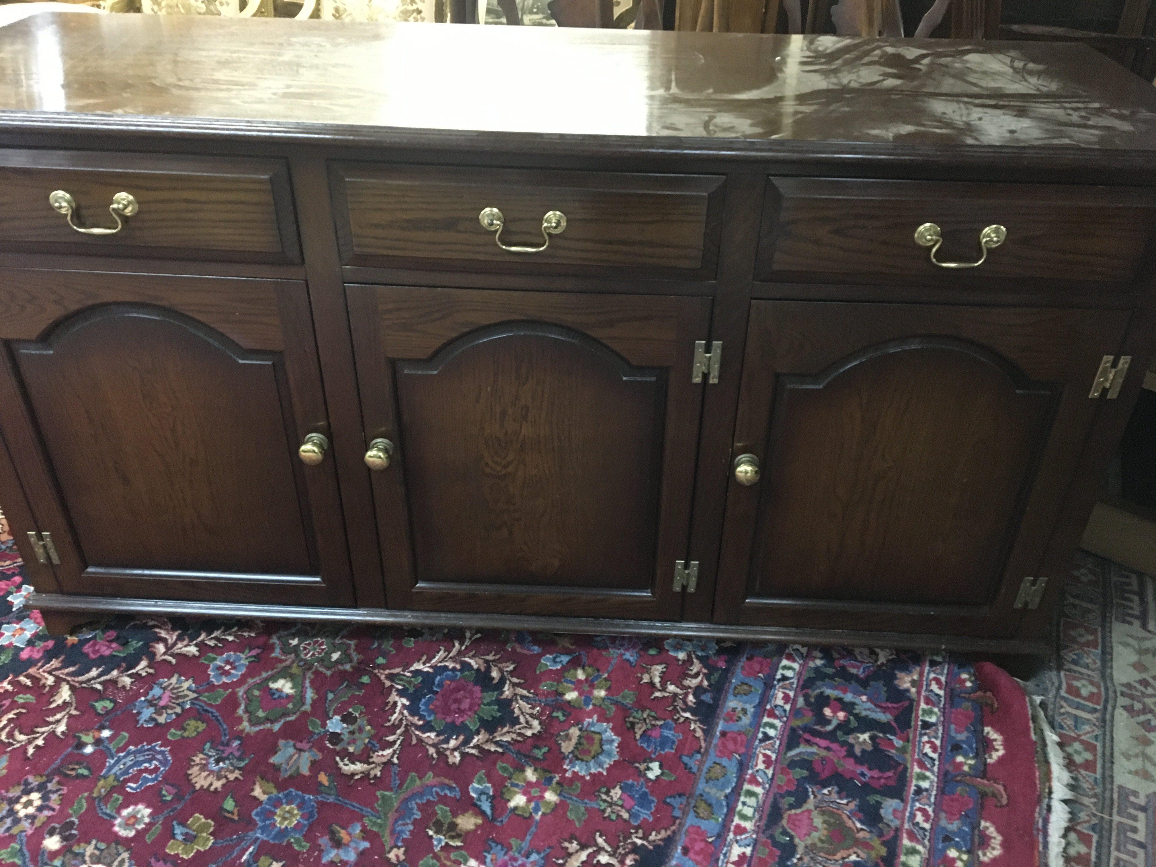A oak sideboard fitted with three drawers and three cupboards under .