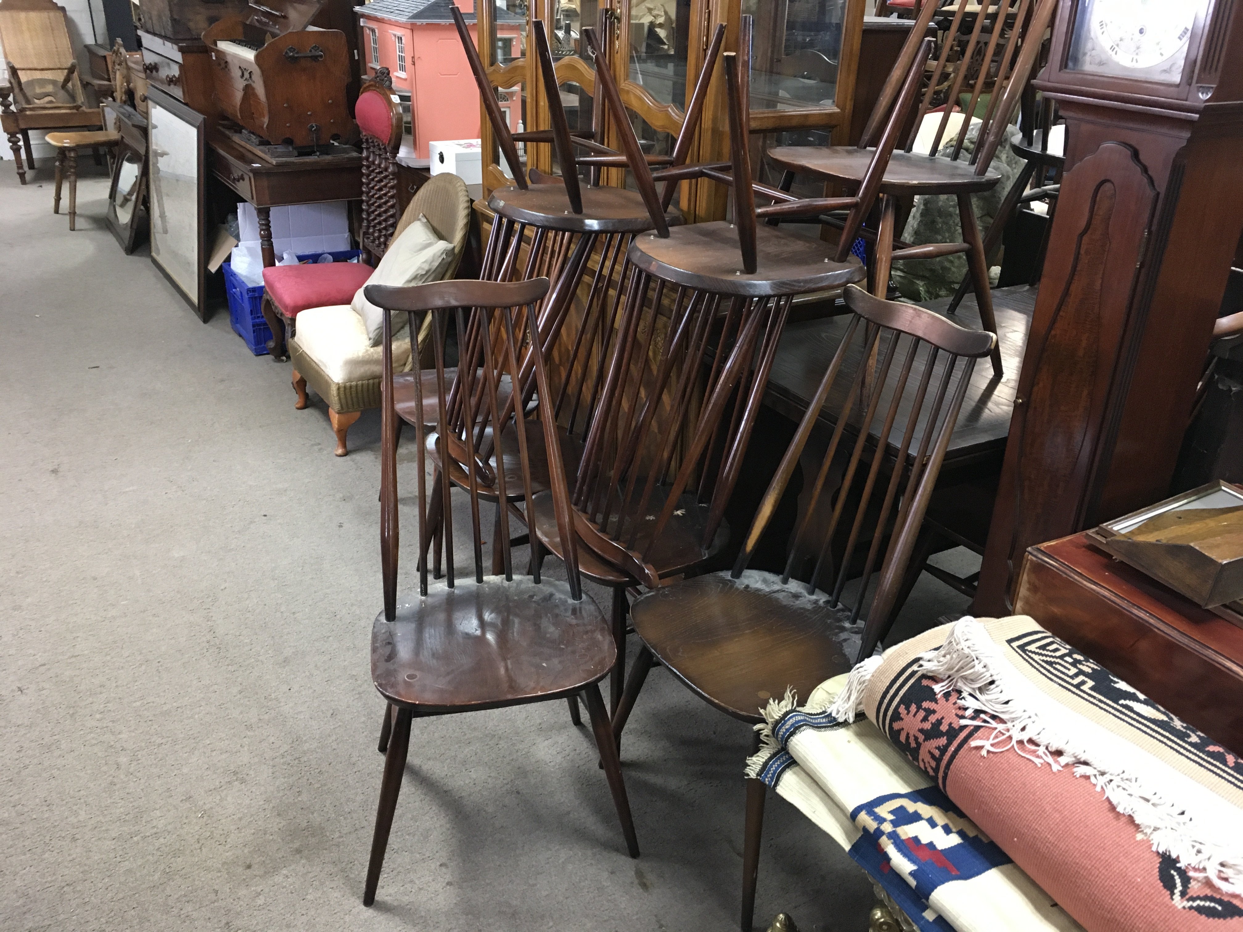 Ten Ercol dark wood chairs , 96cm tall.