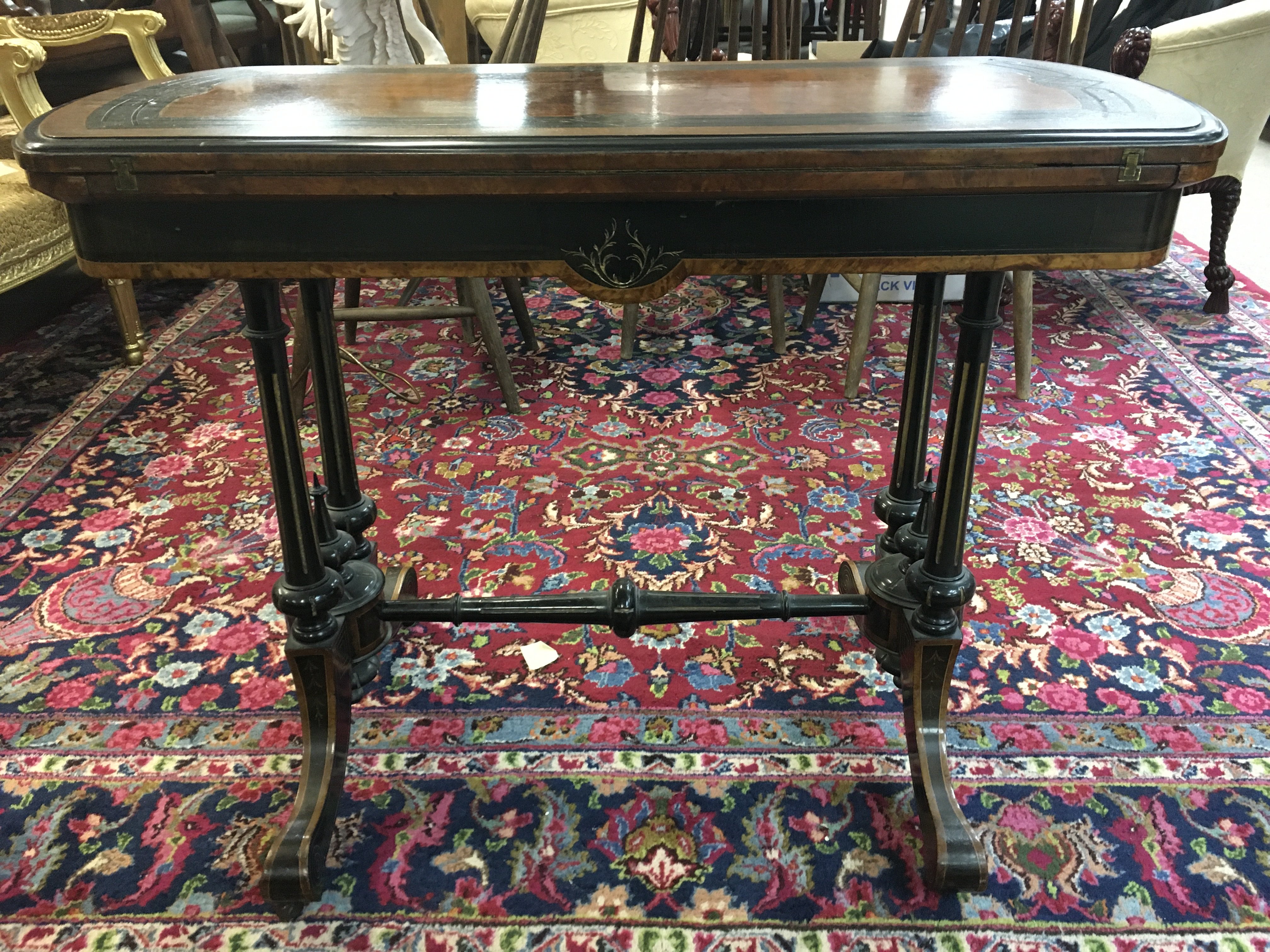 A walnut and ebony inlaid card table 89cm wide 68cm tall