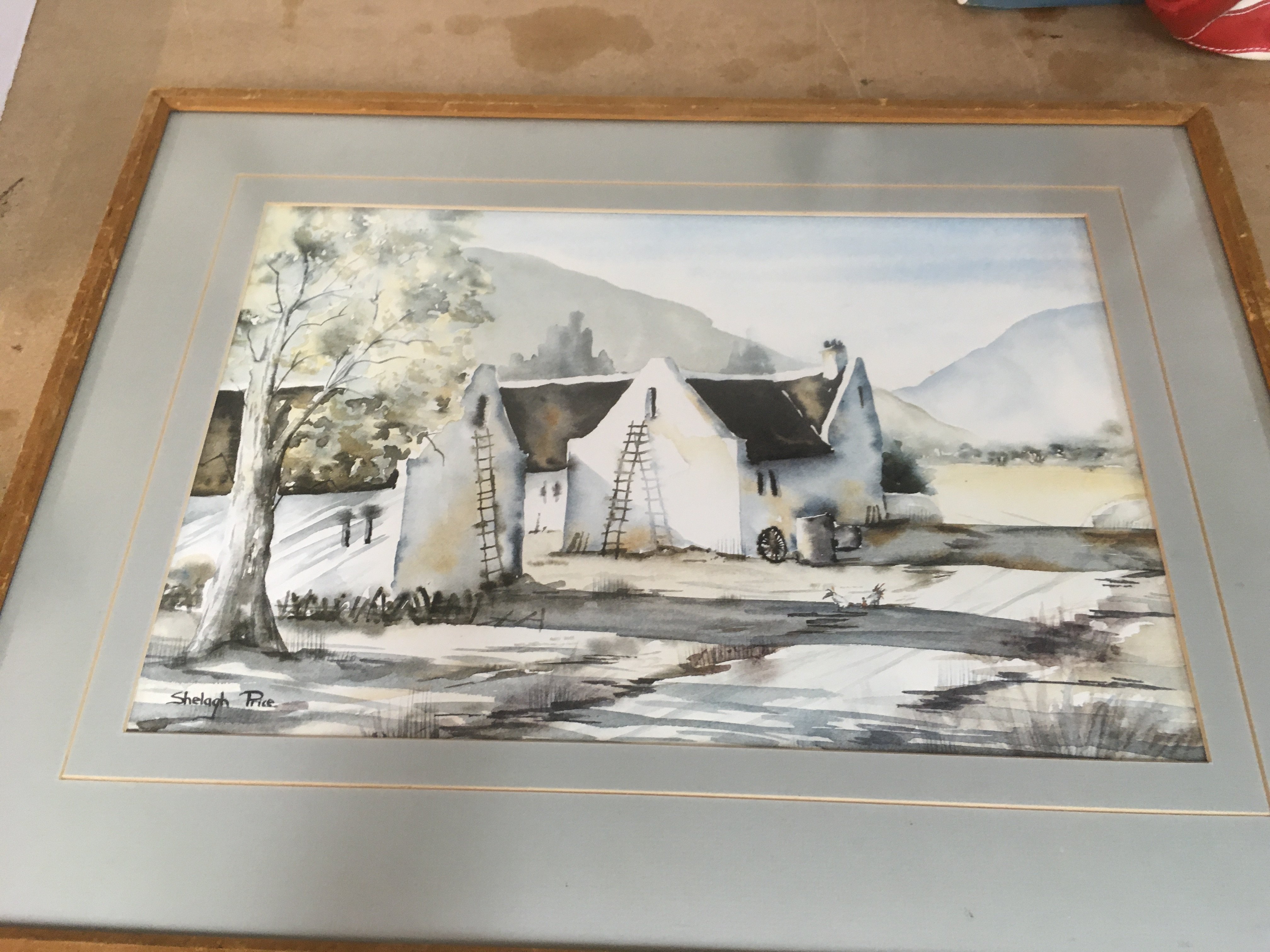 A pair of framed water coulors depicting contry side cottages signed by shelagh price 42cm by 30. NO RESERVE