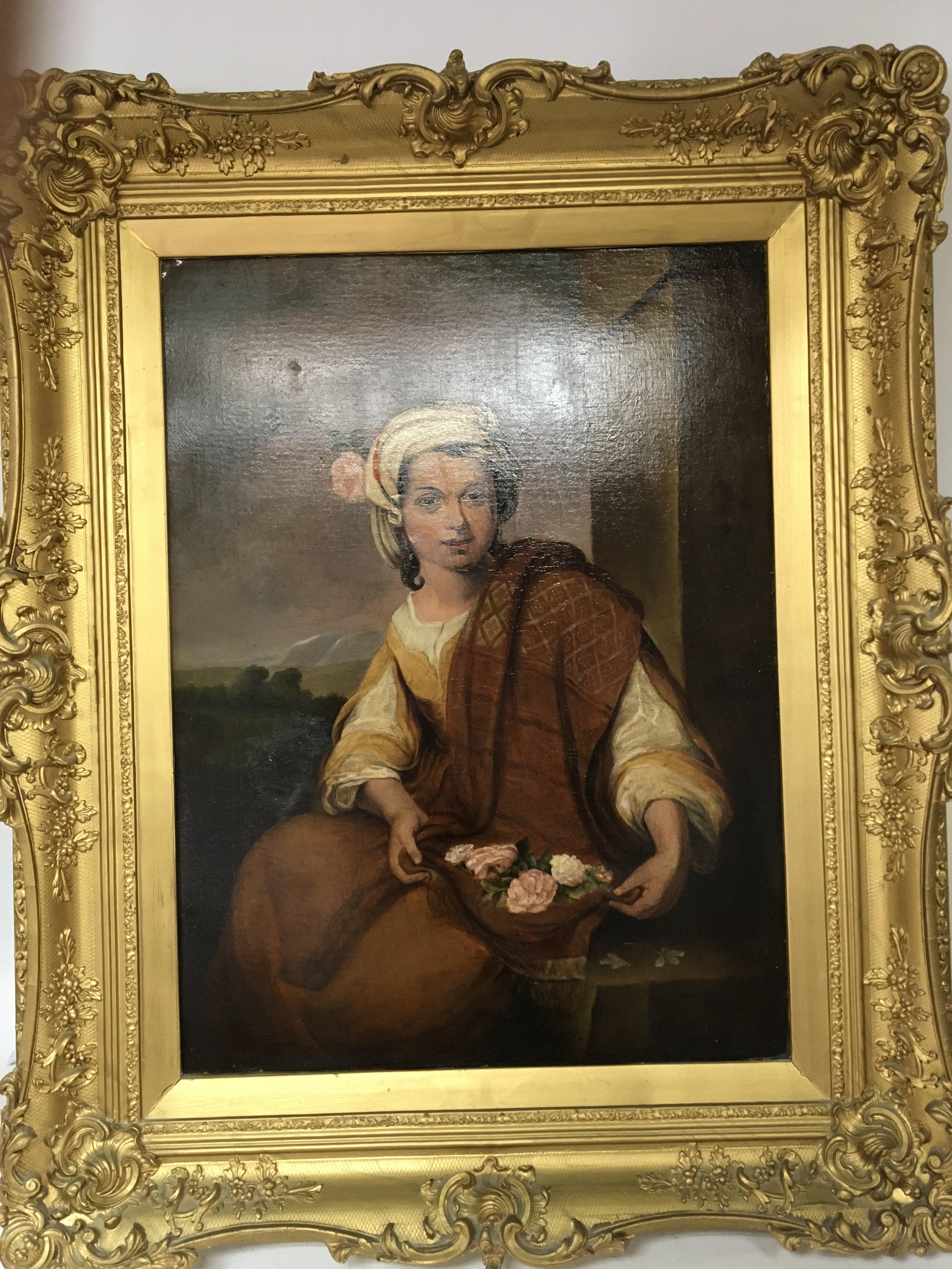 An early 19th. century oil painting on canvas of a young girl holding a collection of flowers The flower girl a perfection of spring a copy of the original by Bartolme Esteban Murillo. unsigned the painting relined and with repair. 83x67cm