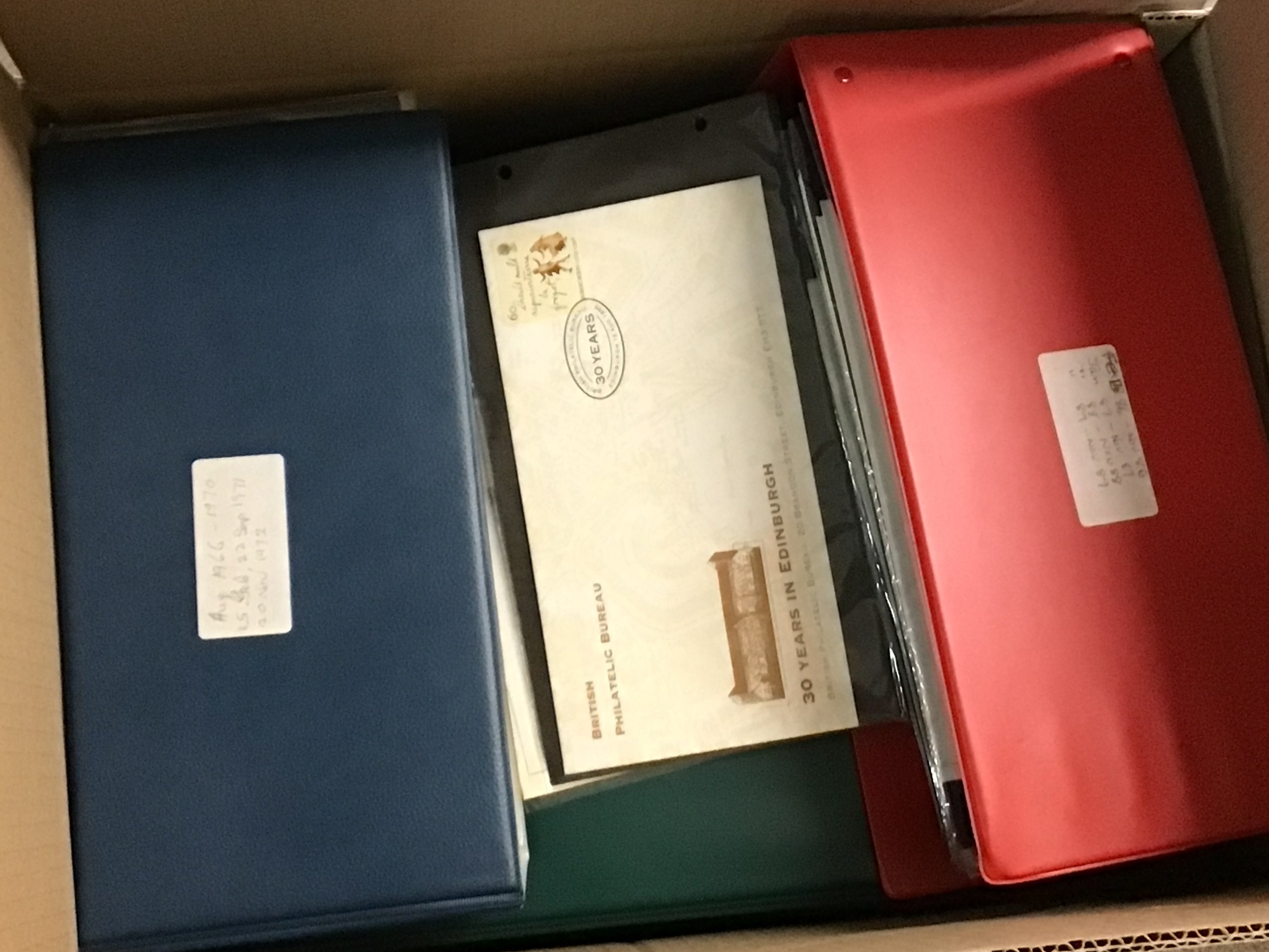 A box containing a large quantity of British first day stamp covers well presented in albums