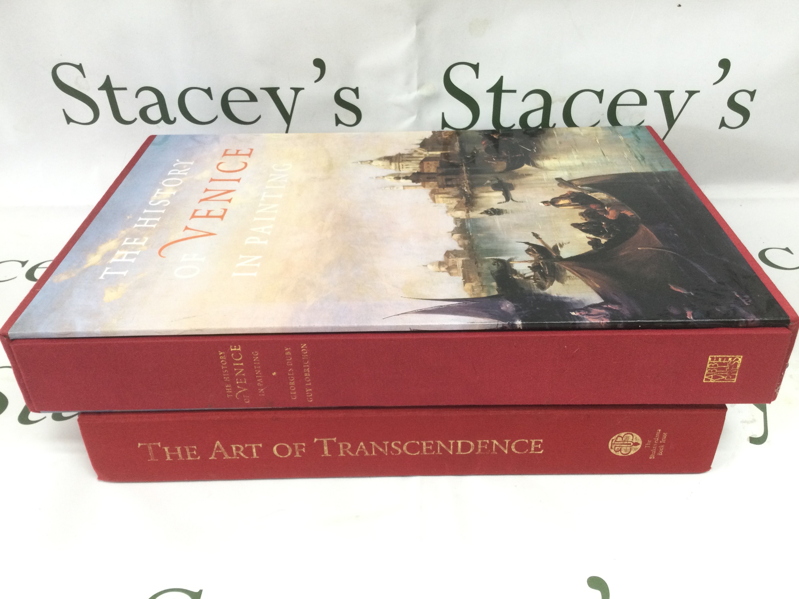 Two large books comprising The Art Of Transcendence and The History Of Venice In Painting both with original slip cases. Shipping category D.
