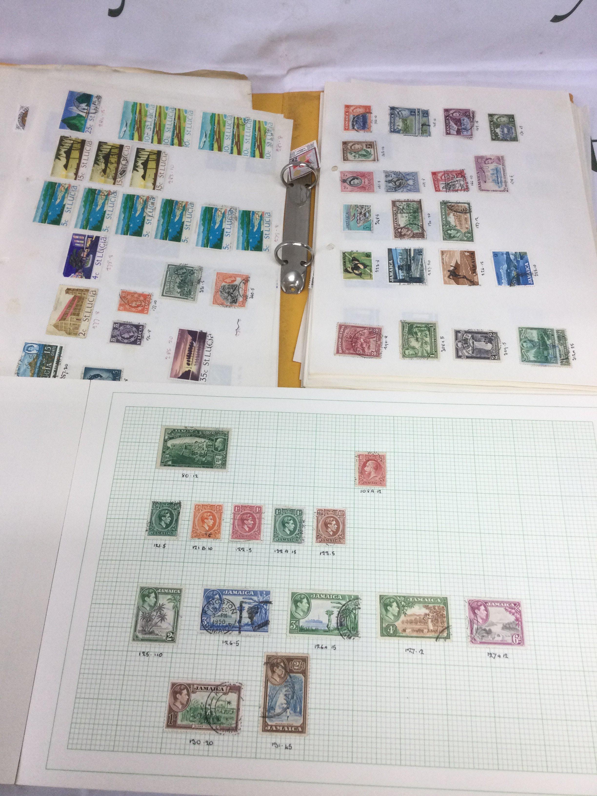 Four folders of GB and world stamps including Penny Reds. Shipping category C.