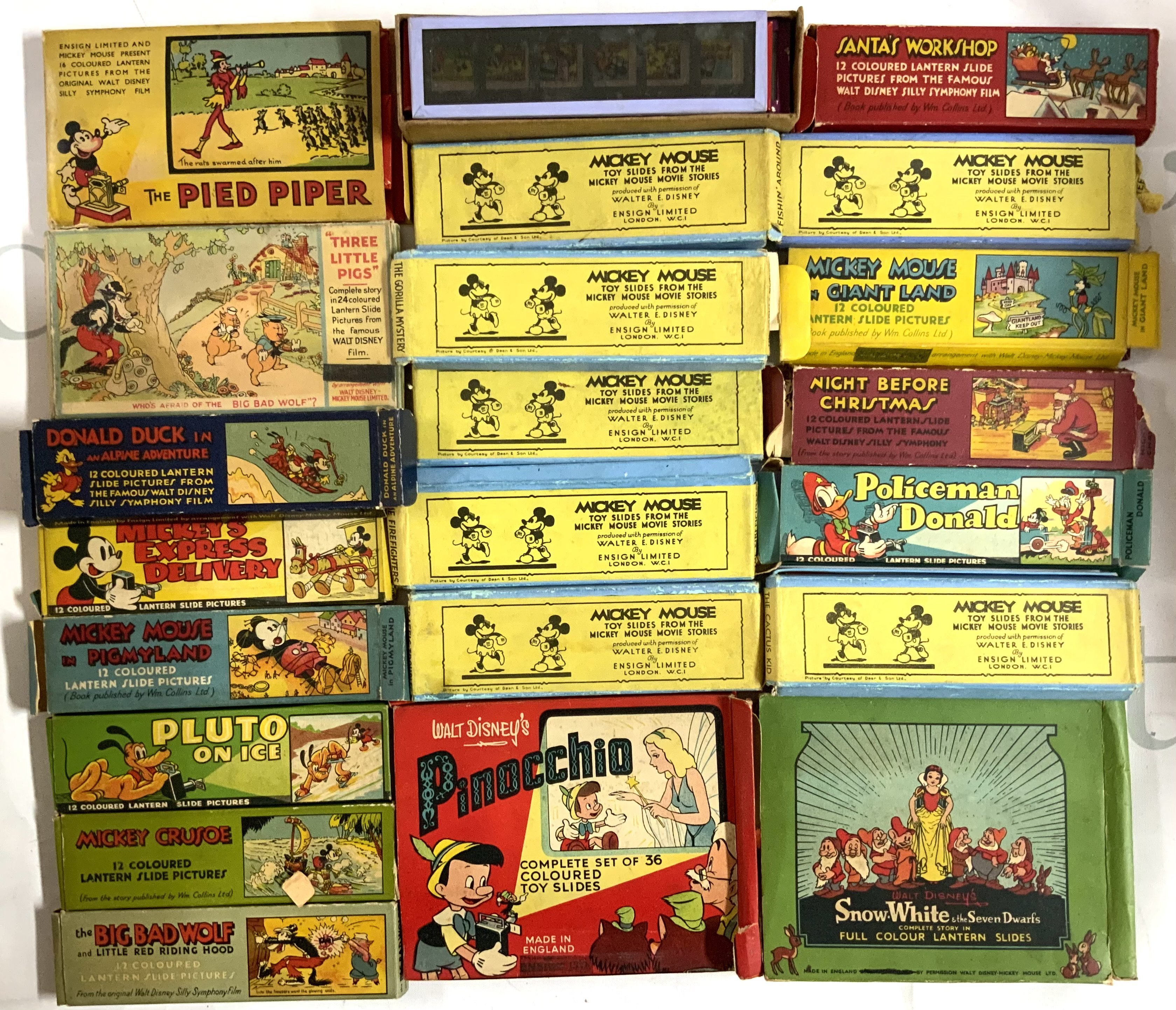 A collection of Disney magic lantern slides together with a home made magic lantern projector. (D)