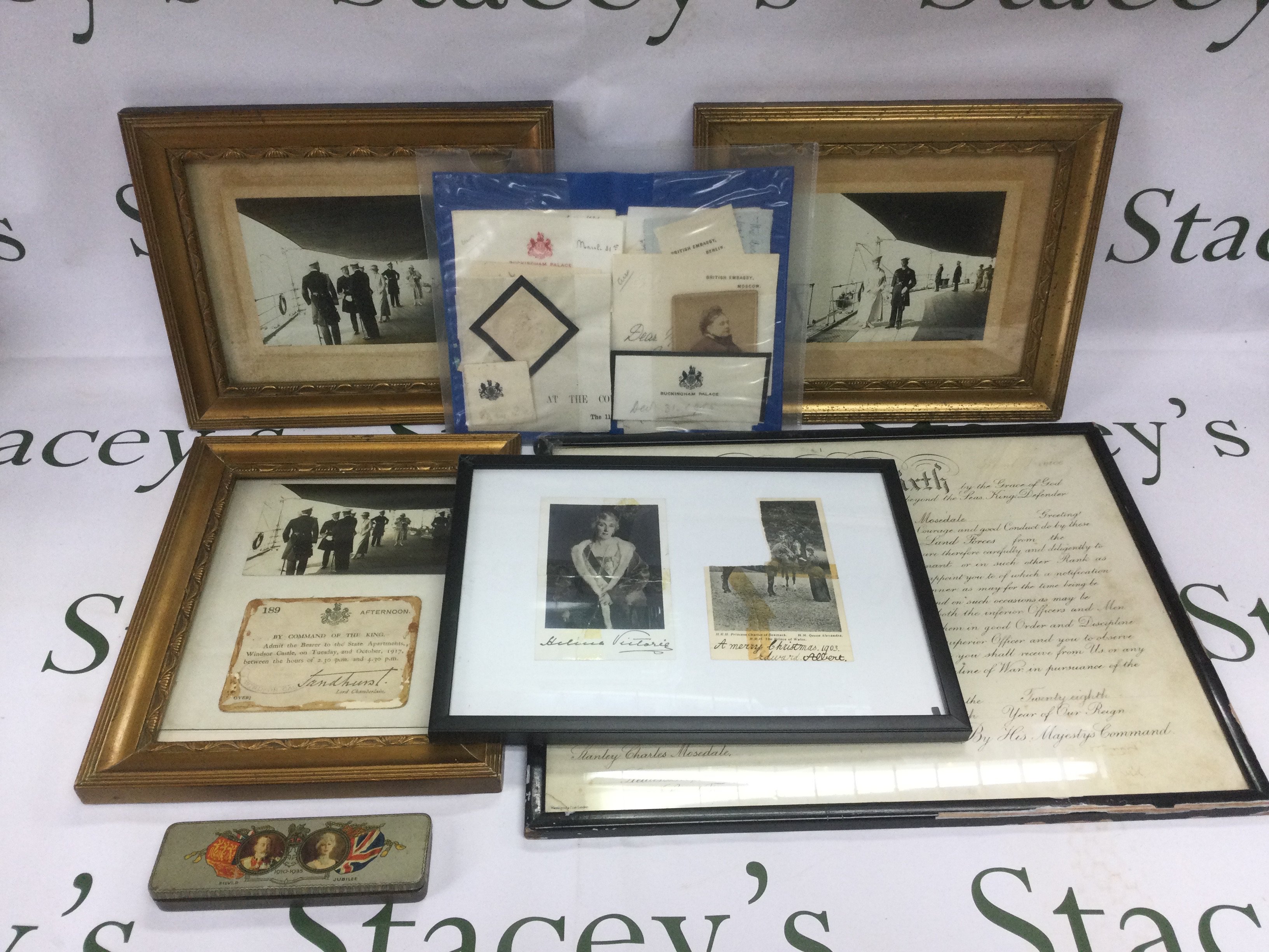 A collection of royal memorabilia comprising three framed and glazed photographs of King George V and Queen Mary, a signed George VI document, signed postcards of Prince Albert and Princess Helena Victoria etc. Shipping category D.