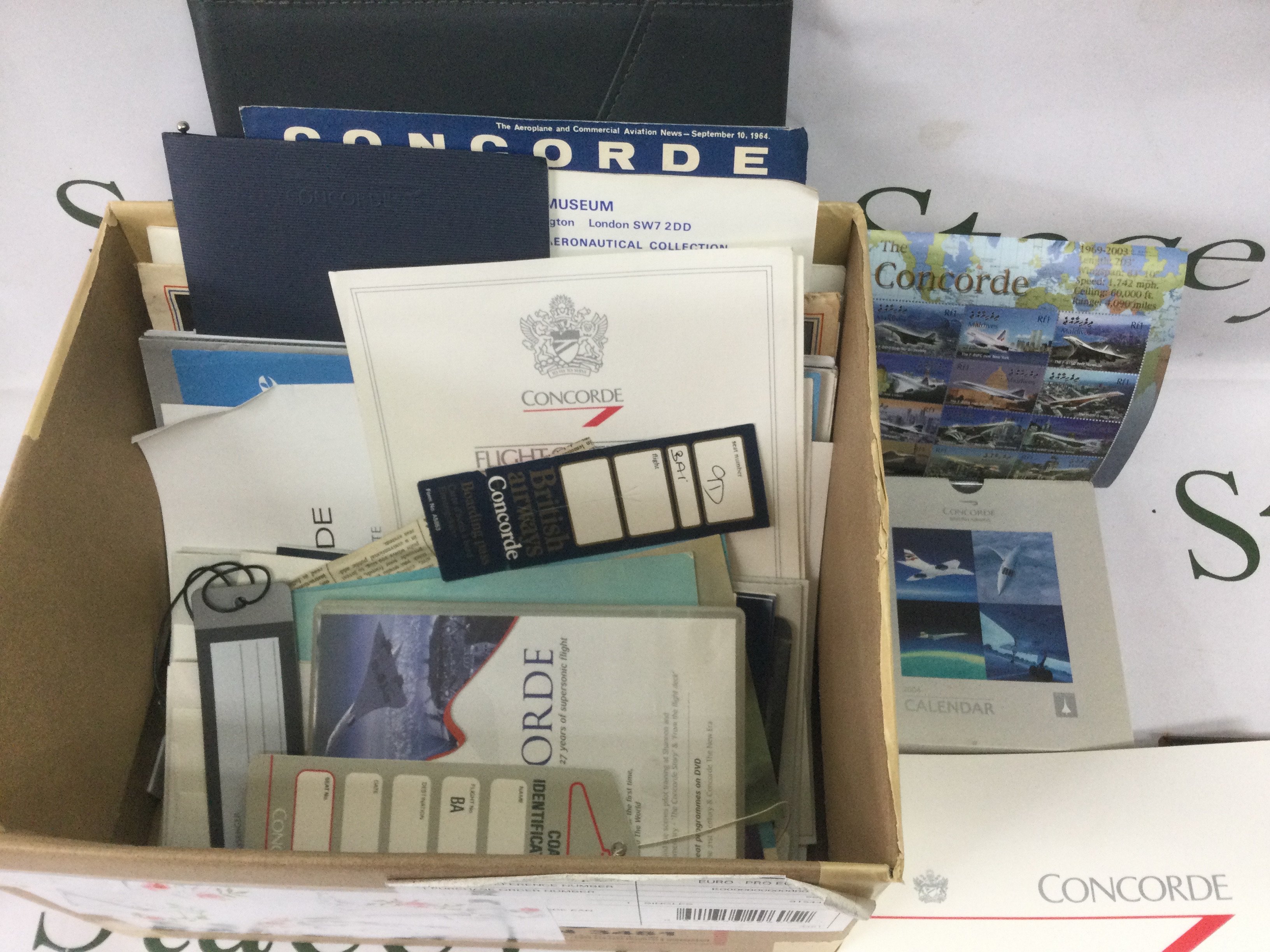 A collection of Concorde memorabilia including a signed limited edition print, documents, tags etc. Shipping category D