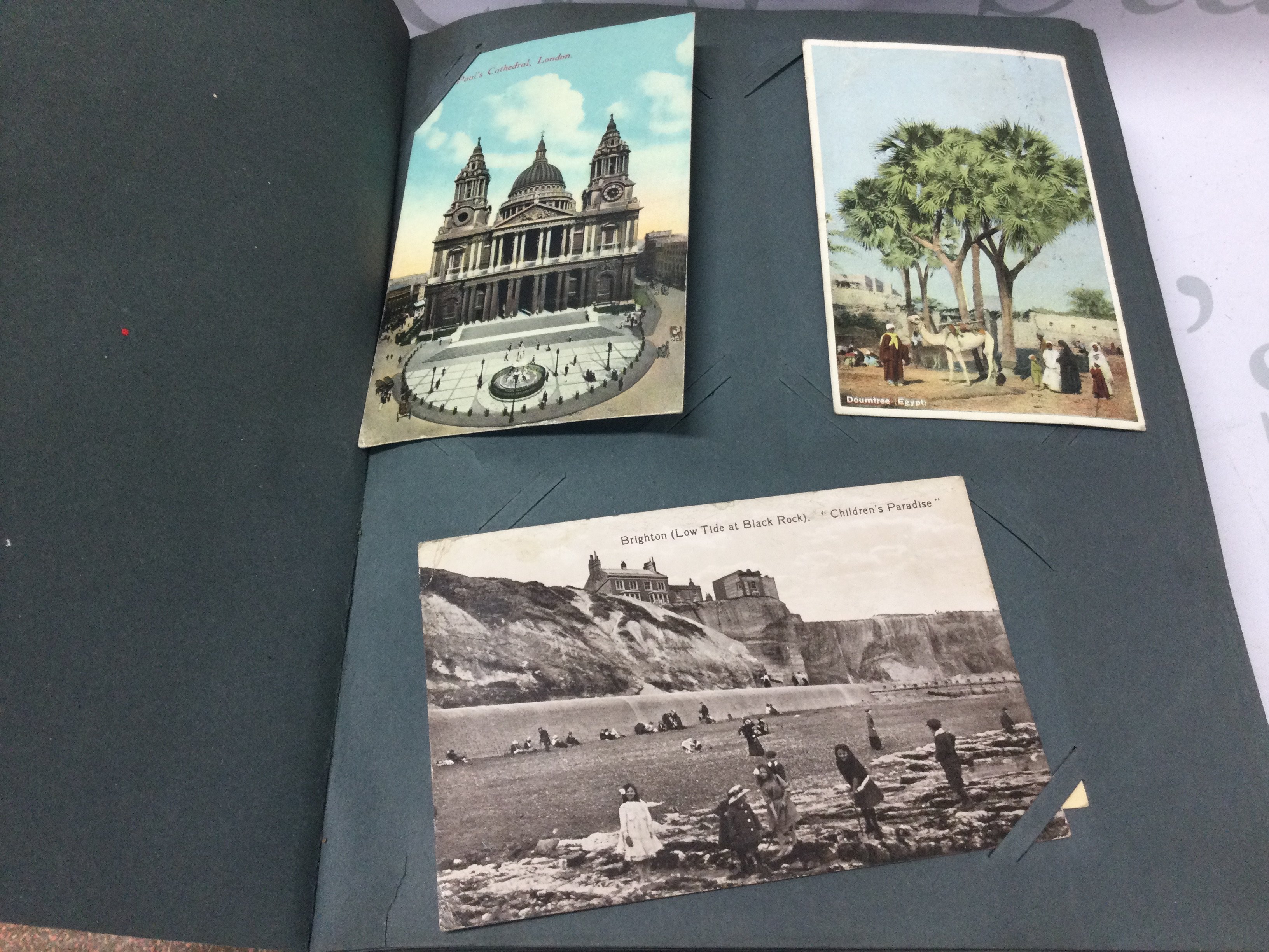 An album of post cards including Edwardian examples.