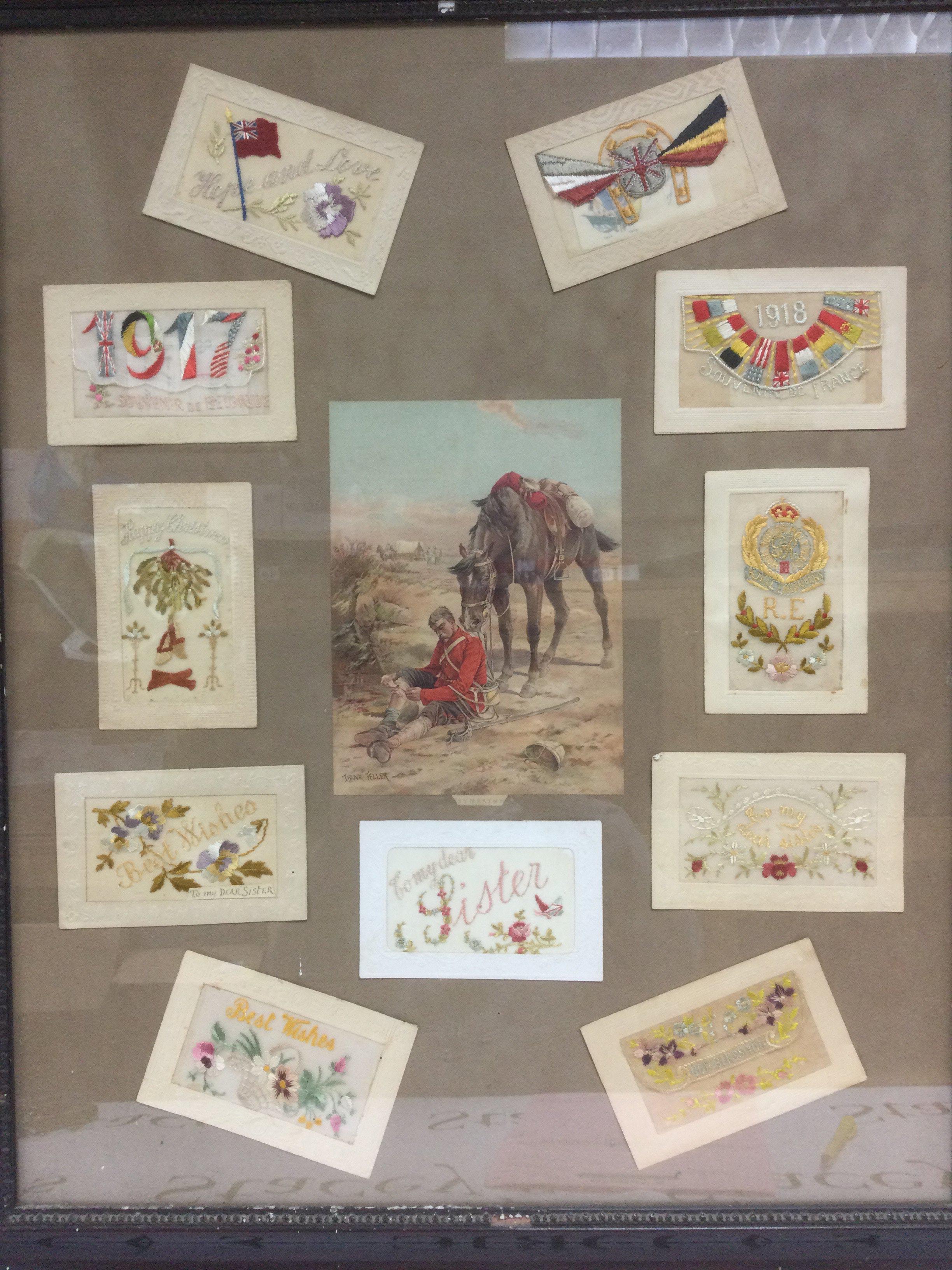 A framed and glazed collection of WW1 silk postcards. Shipping category D.