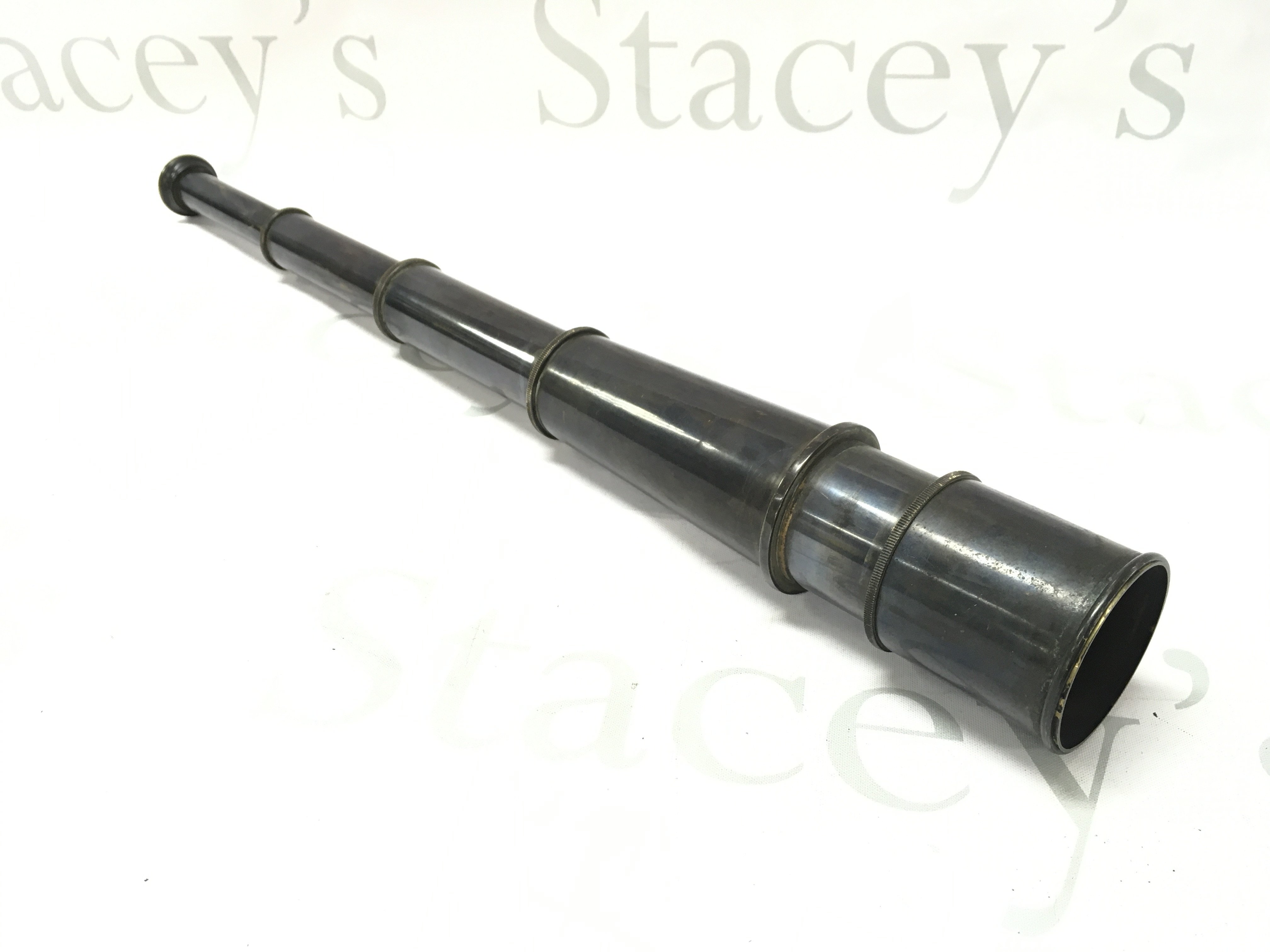 A navy telescope, 18.5cm long , 47.5cm long fully extended. Postage category B