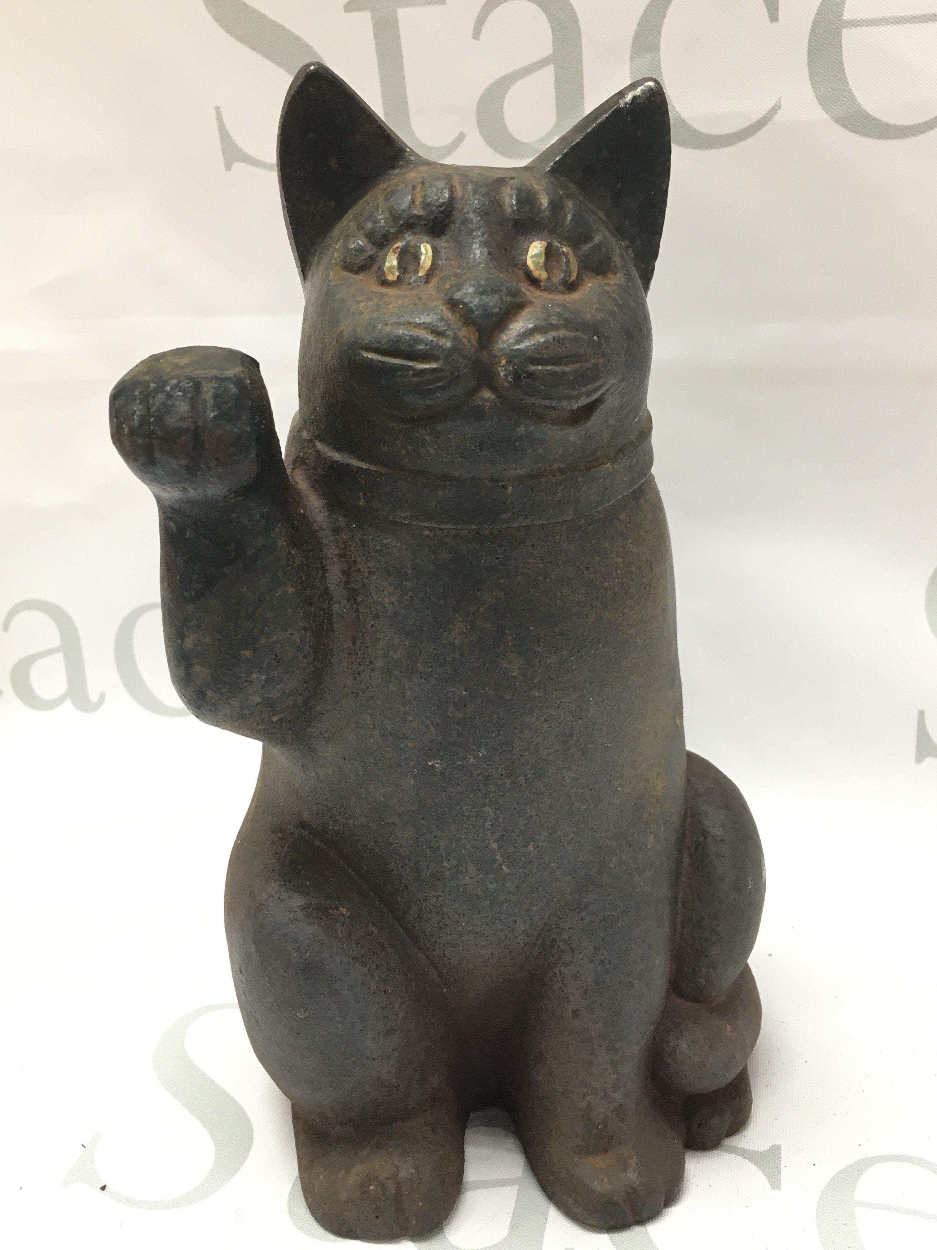 A vintage cast iron Maneki-Neko cat, 22cm tall. Postage category B