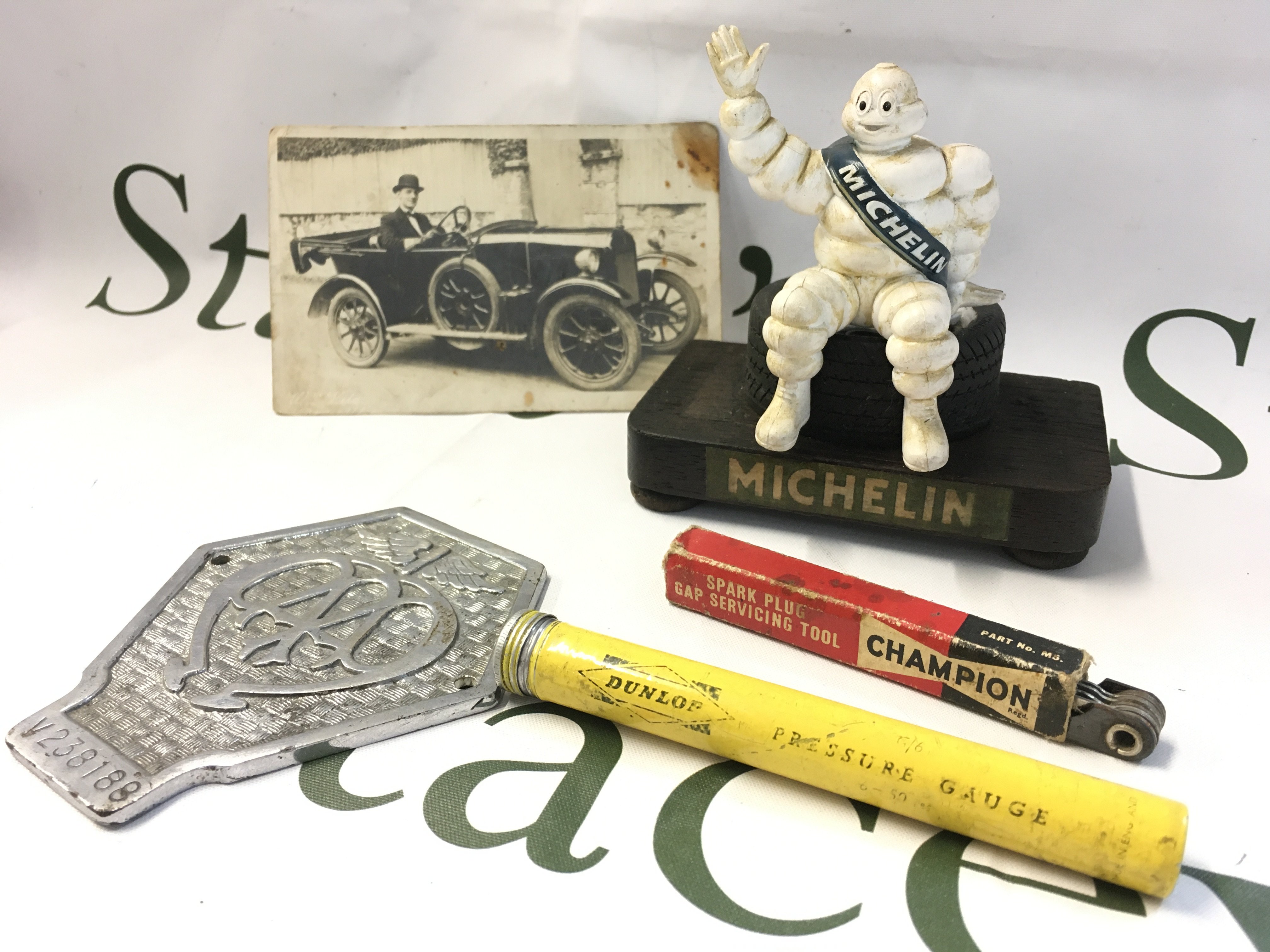 A Michelin man figure, commercial AA badge, pressure gauge etc . Postage category B