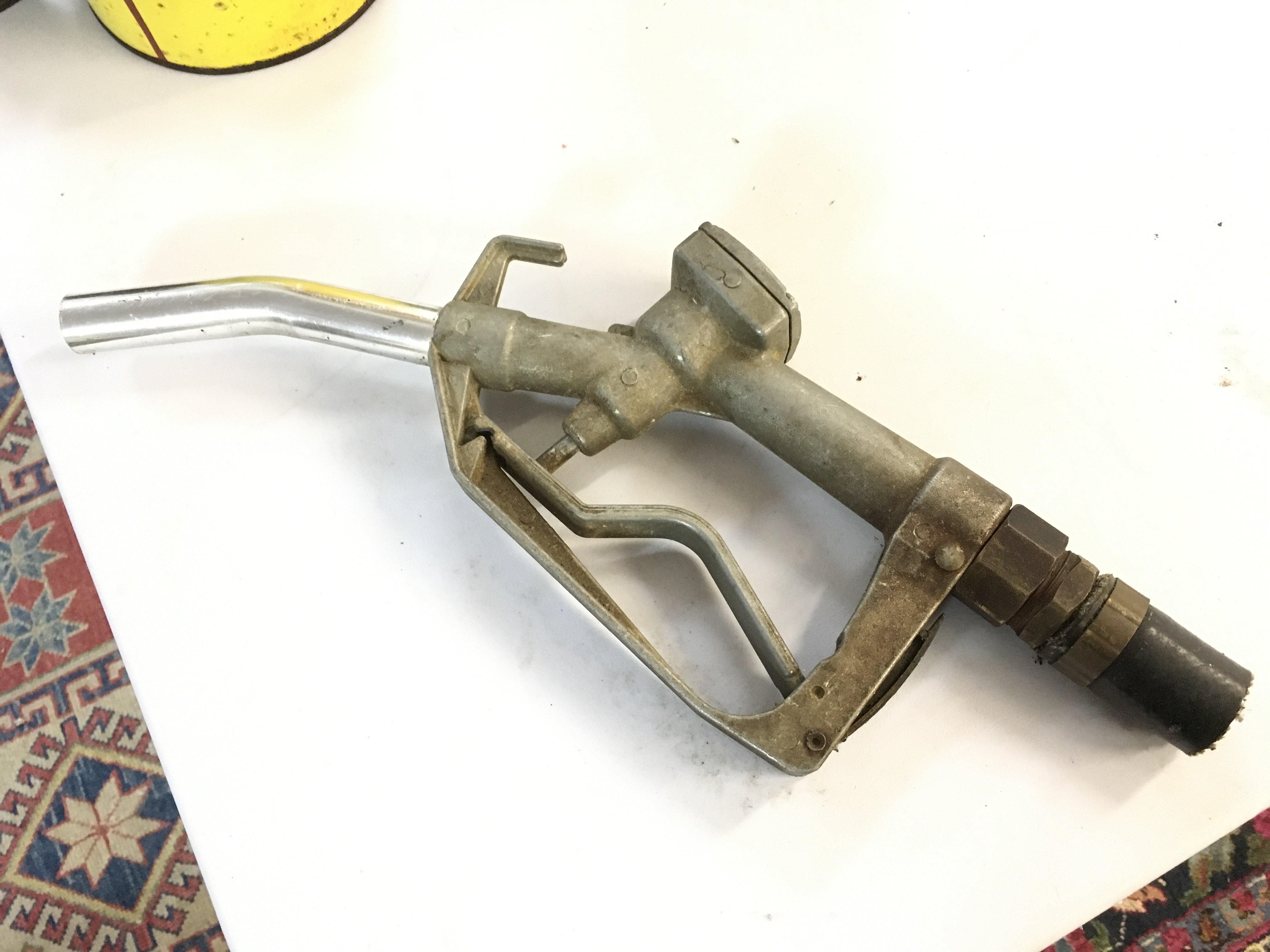 A vintage petrol pump nozzle, no reserve postage category C