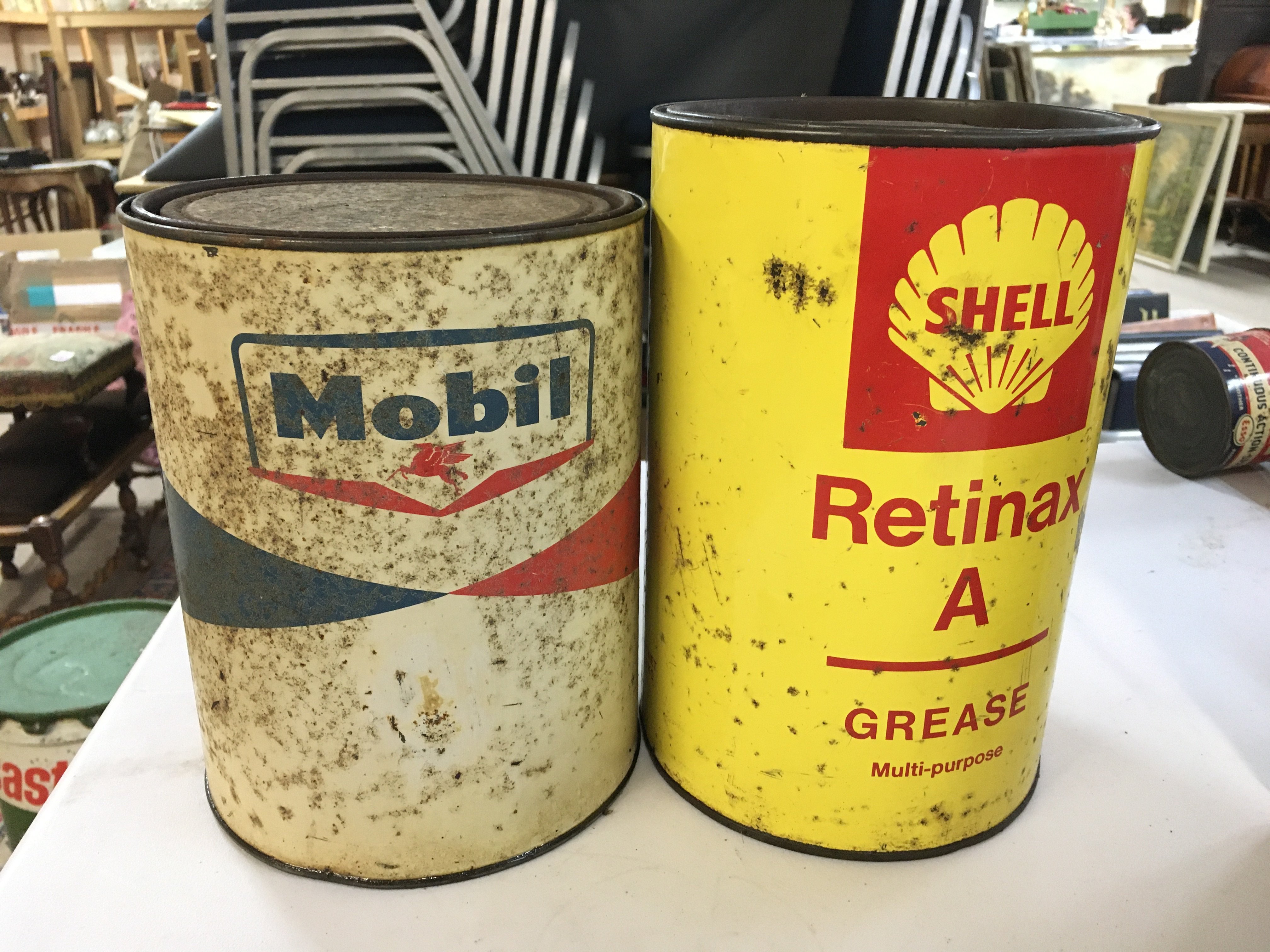 Heavy Mobil full grease can and a Duckhams Admax grease can
