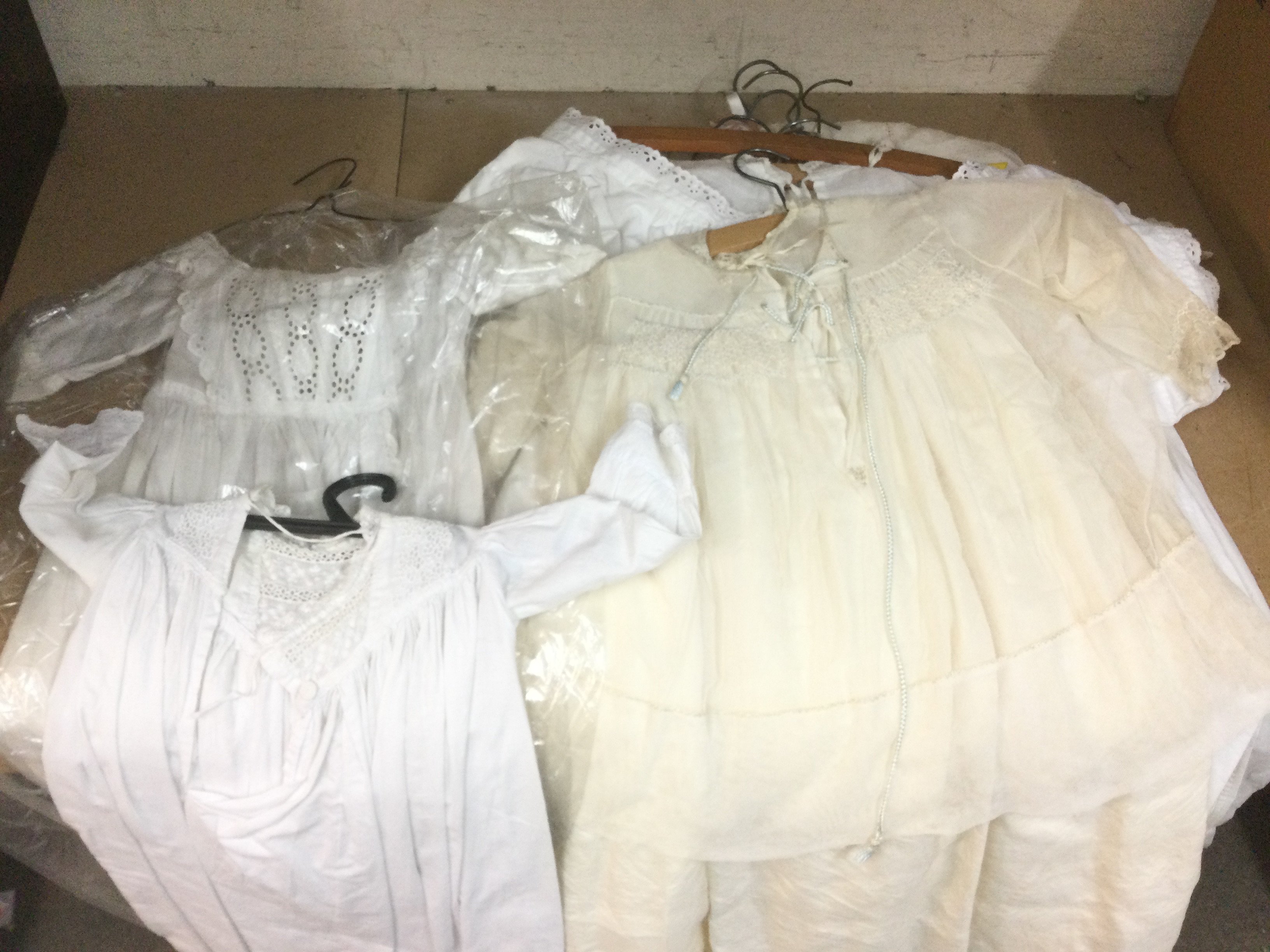 A collection of christening gowns. Shipping category C.