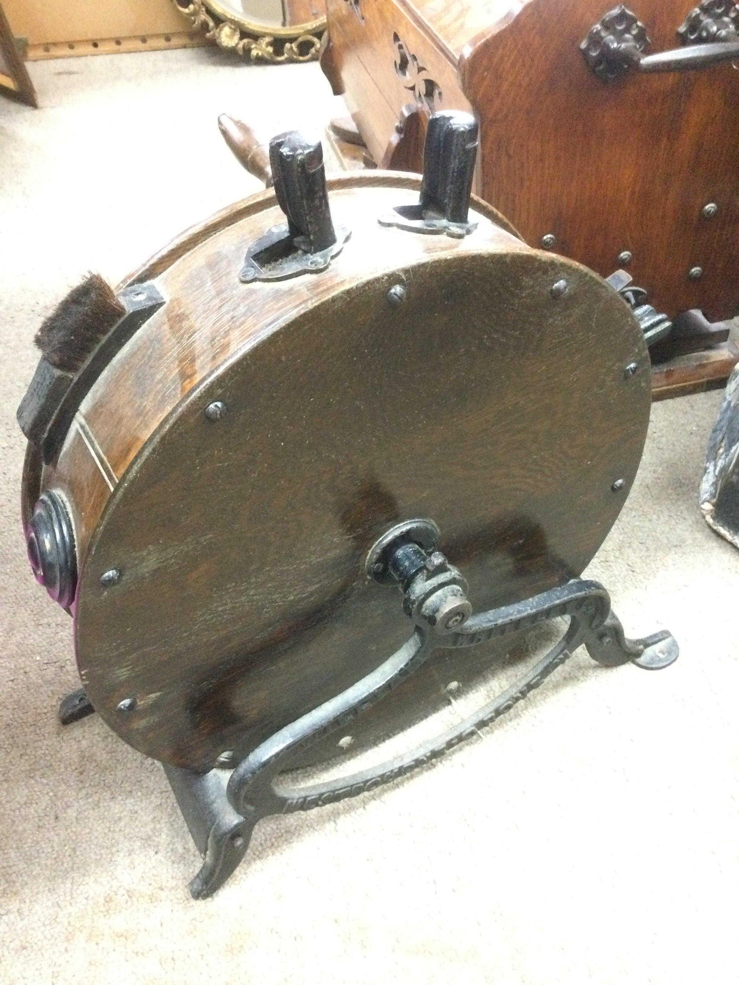 A William Whiteley Ltd cast iron and oak knife sharpener. Shipping category D.