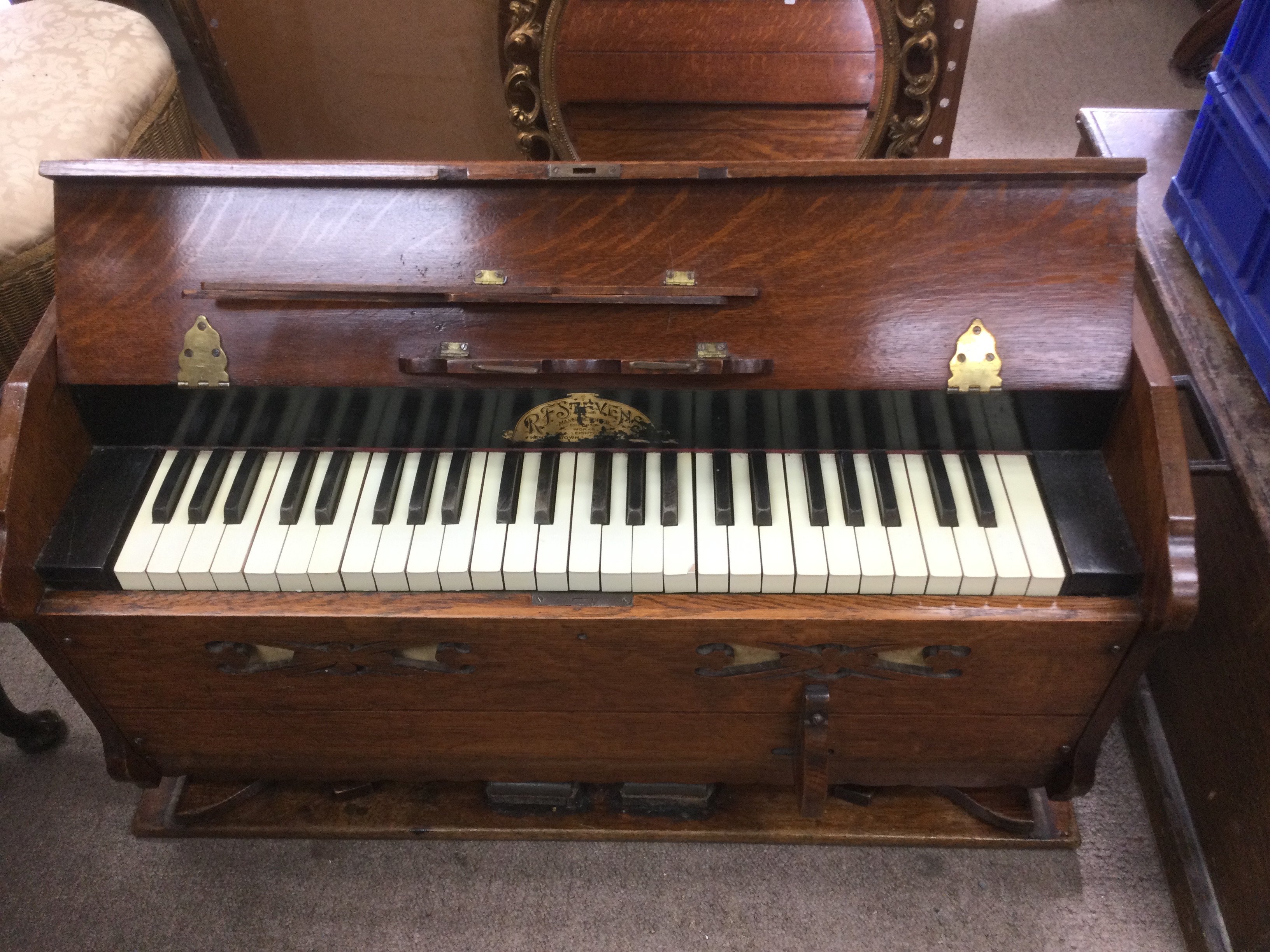 An RF Stevens ship's reed organ. Shipping category D.