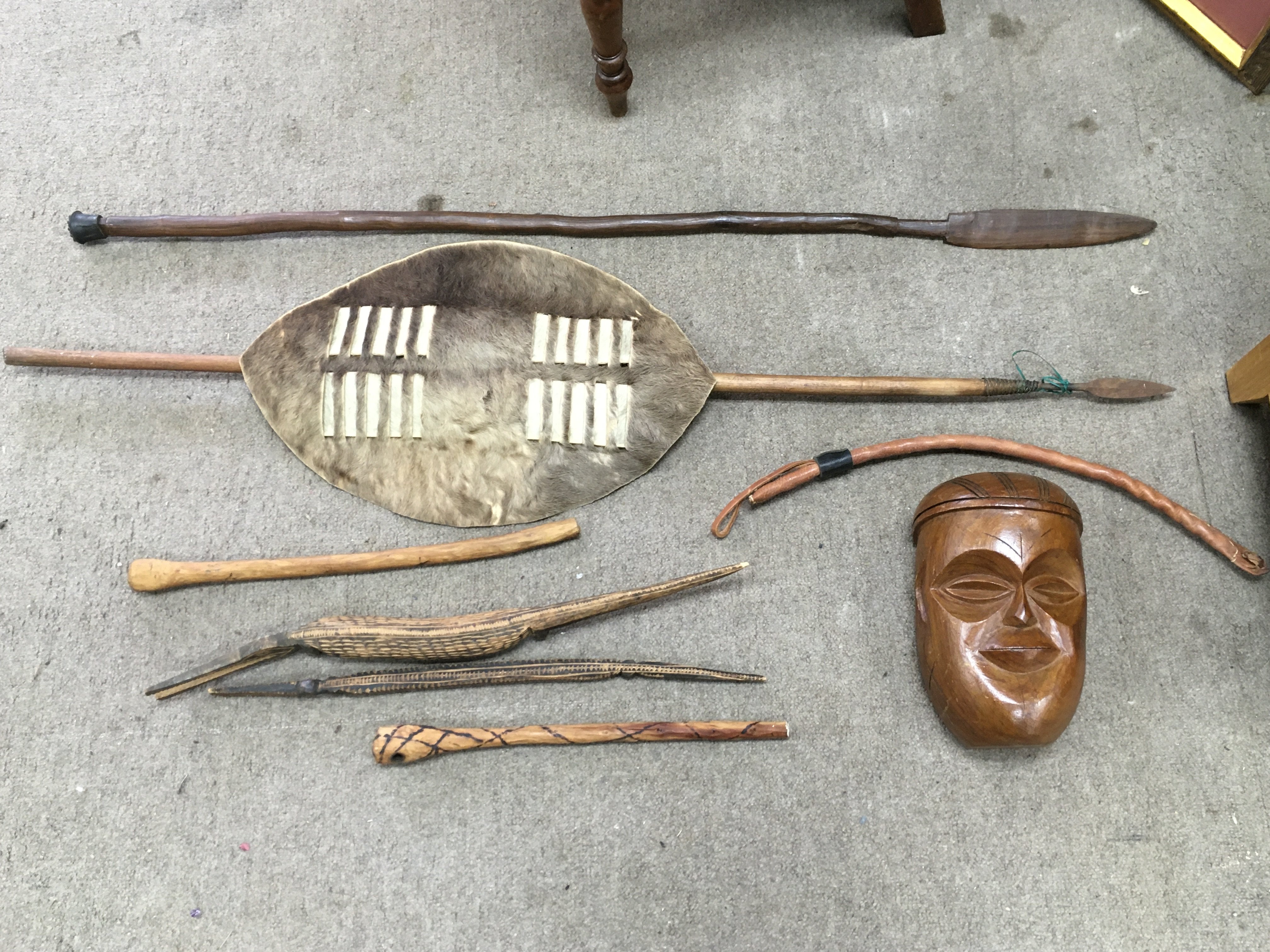 Tribal including a mask, spears, wooden crocodile figures etc. this lot cannot be posted