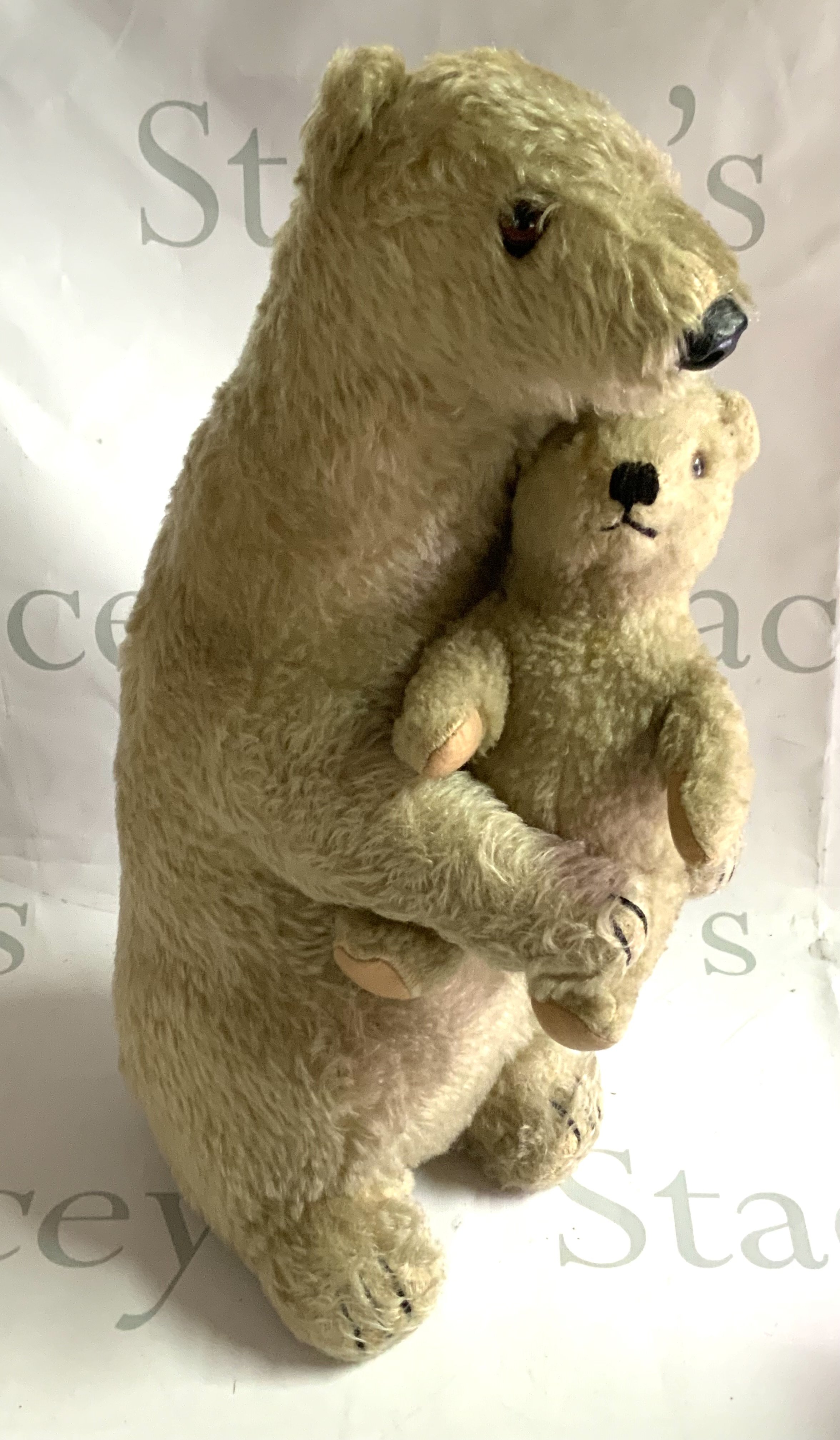 Deans Rag Book Company polar bears, Ivy and Brumas, circa 1949, white mohair plush, both with original labels, largest 46cm. The bears were modelled after the London zoo exhibits, Brumas born in 1949 was the first polar bear to be born in British captivity.(b)