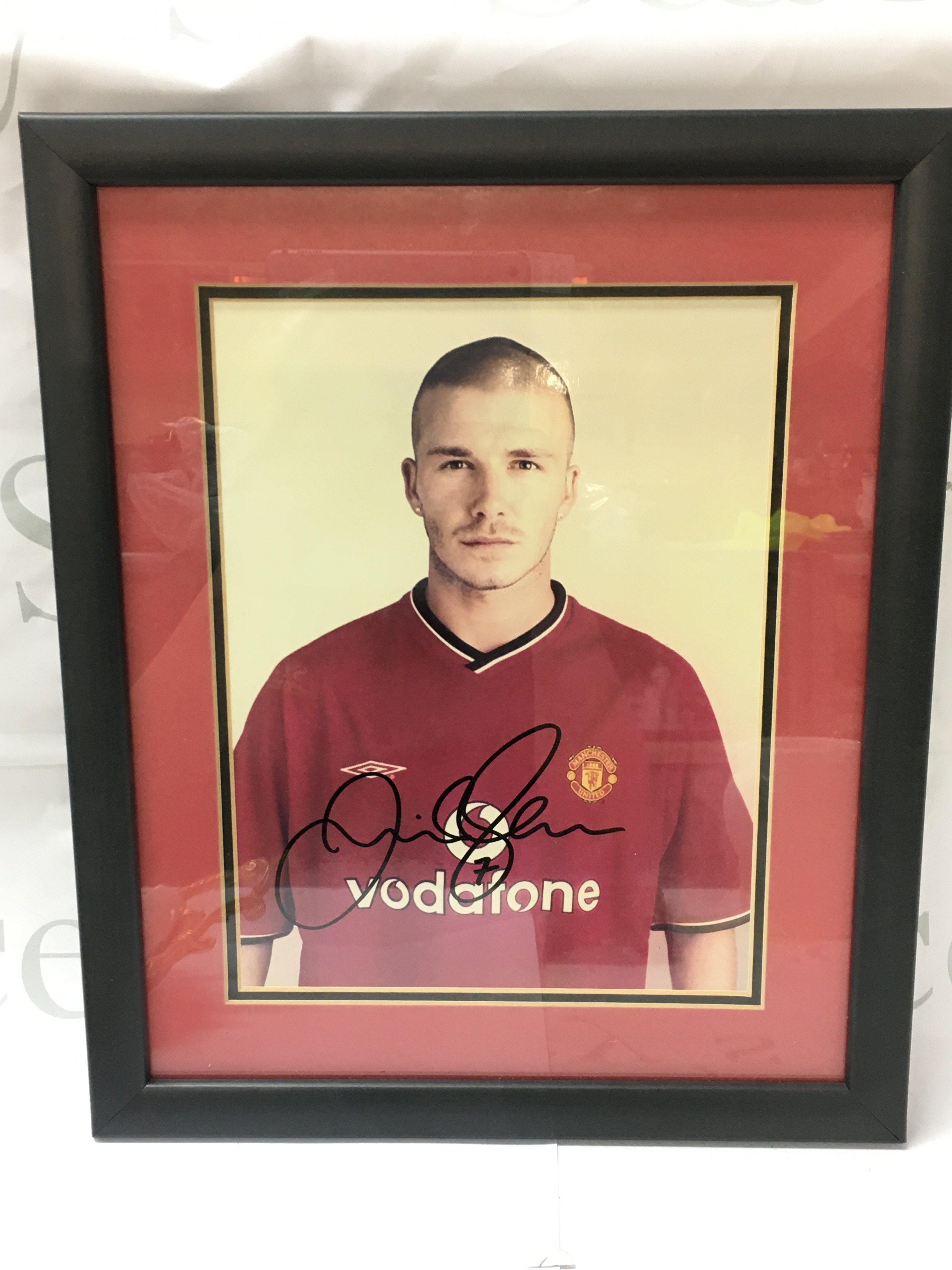 A framed and signed David Beckham print including certificate of authenticity. Postage category B