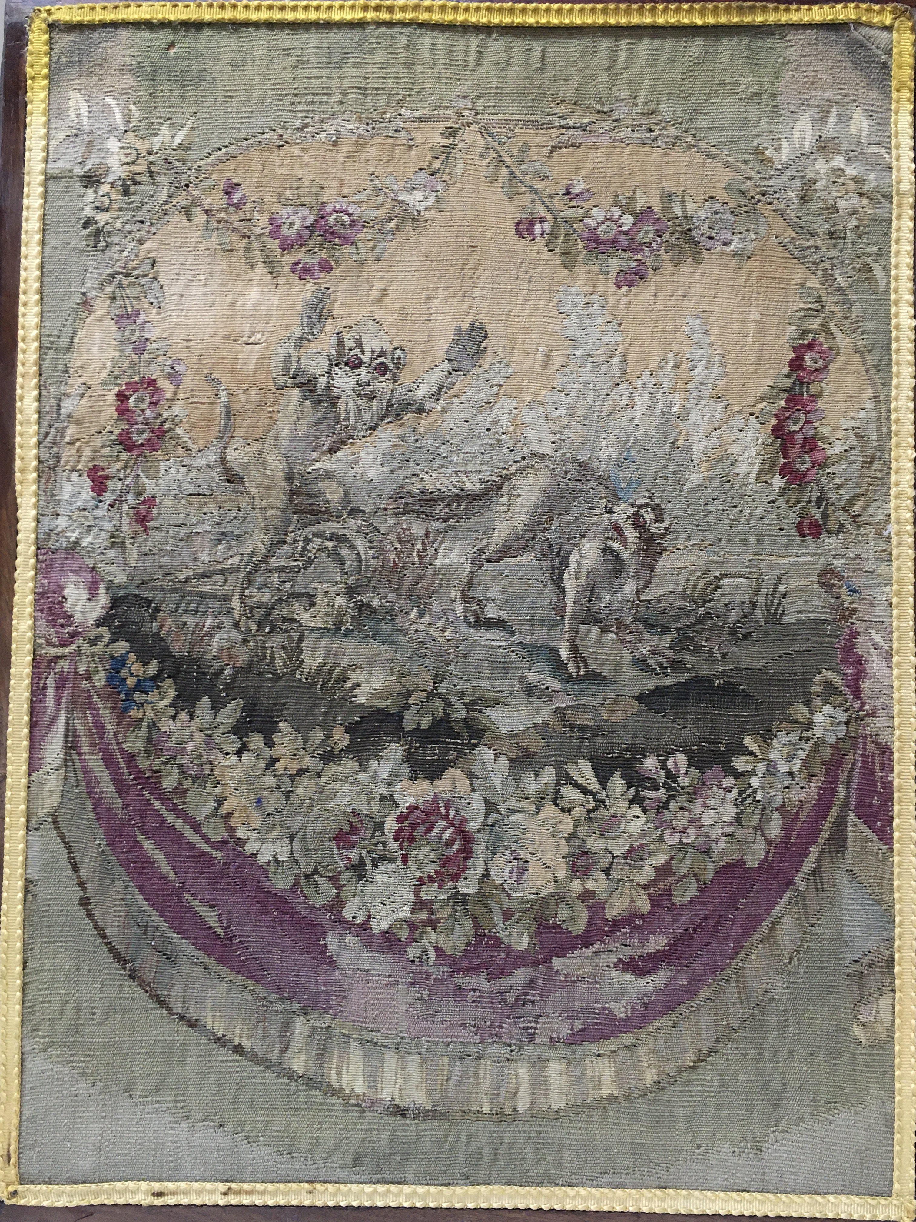 An 18th century framed tapestry of a wolf being chased by a devil dimensions 49x64cm