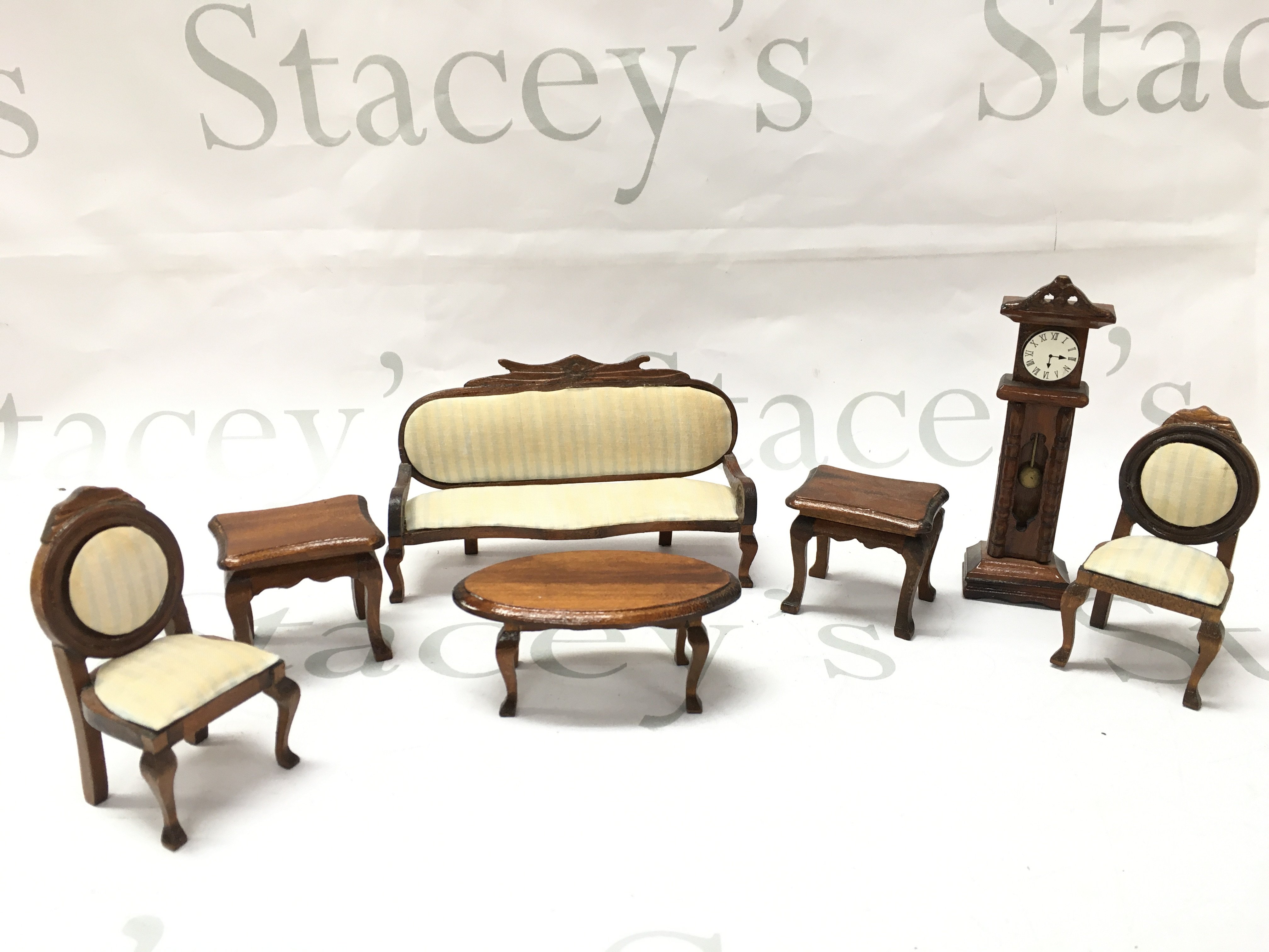 A collection of dollhouse furniture, sofa 14cm wide 9cm tall approximately.