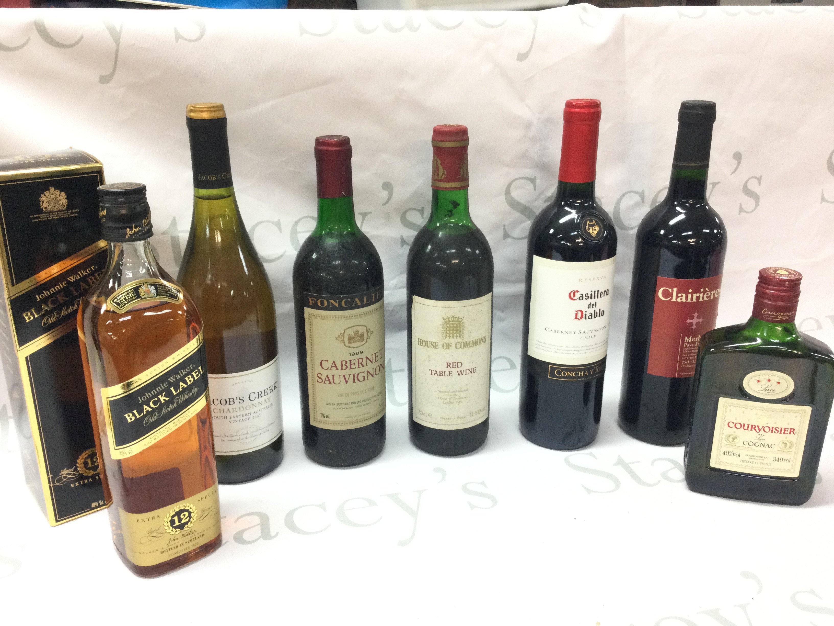 Boxed Jonnie Walker black label, Jacob Creek, Sauvignon 1989, House of Commons Red, Clairieres, Courvoisier Cognac. This lot cannot be posted