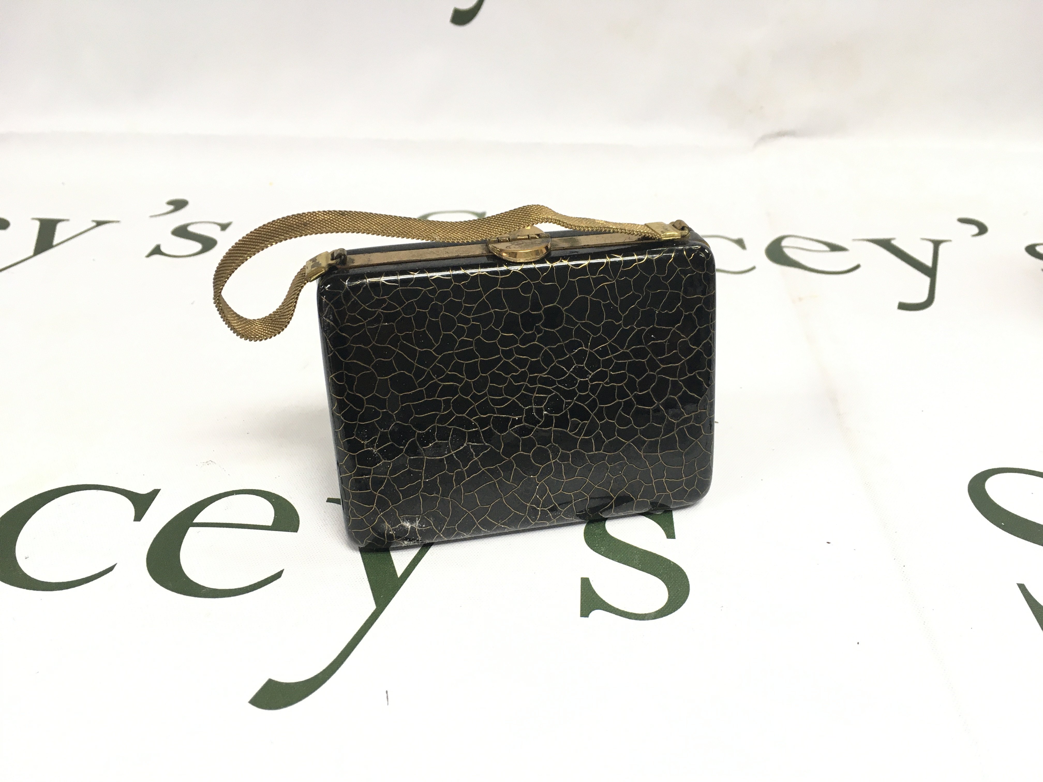 An unusual vintage bag compact.