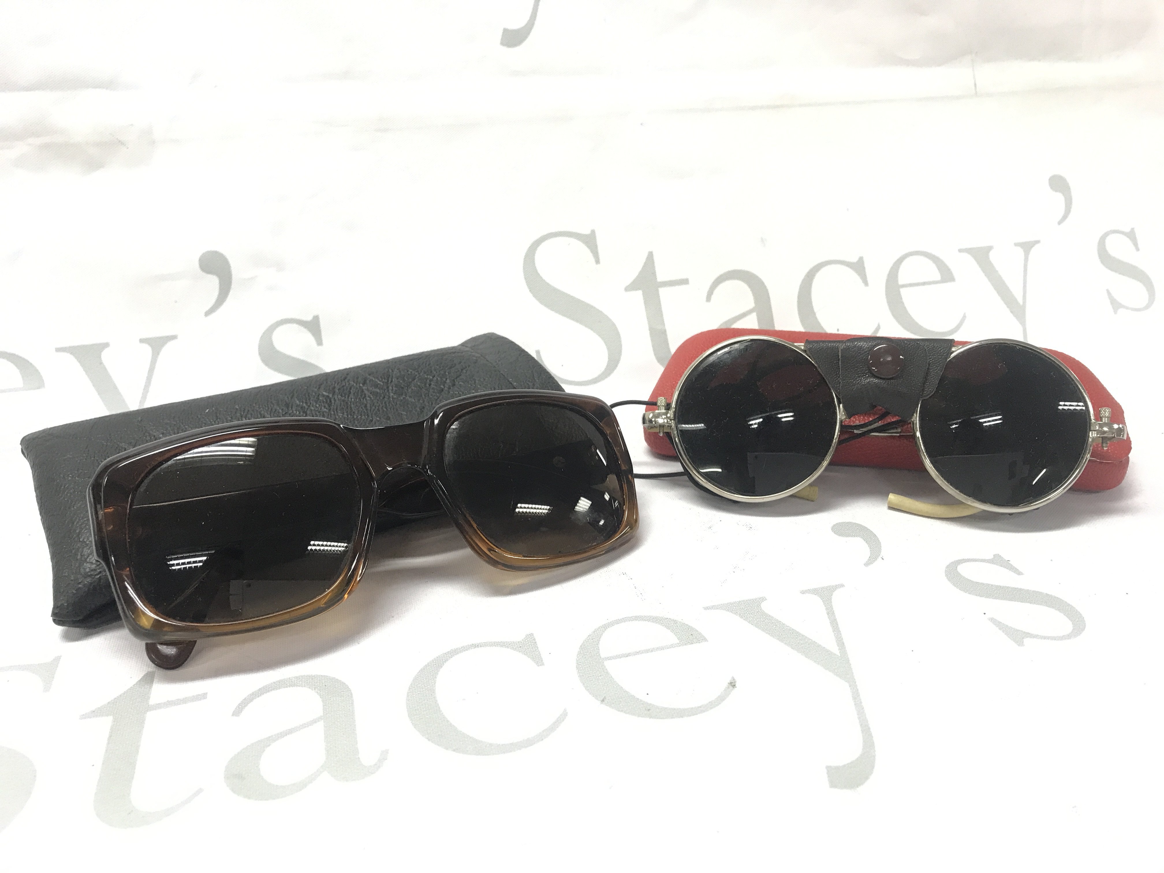 Two pairs of glasses including Mohawk Zeiss vintage sunglasses and Mountaineer sunglasses . Postage category B