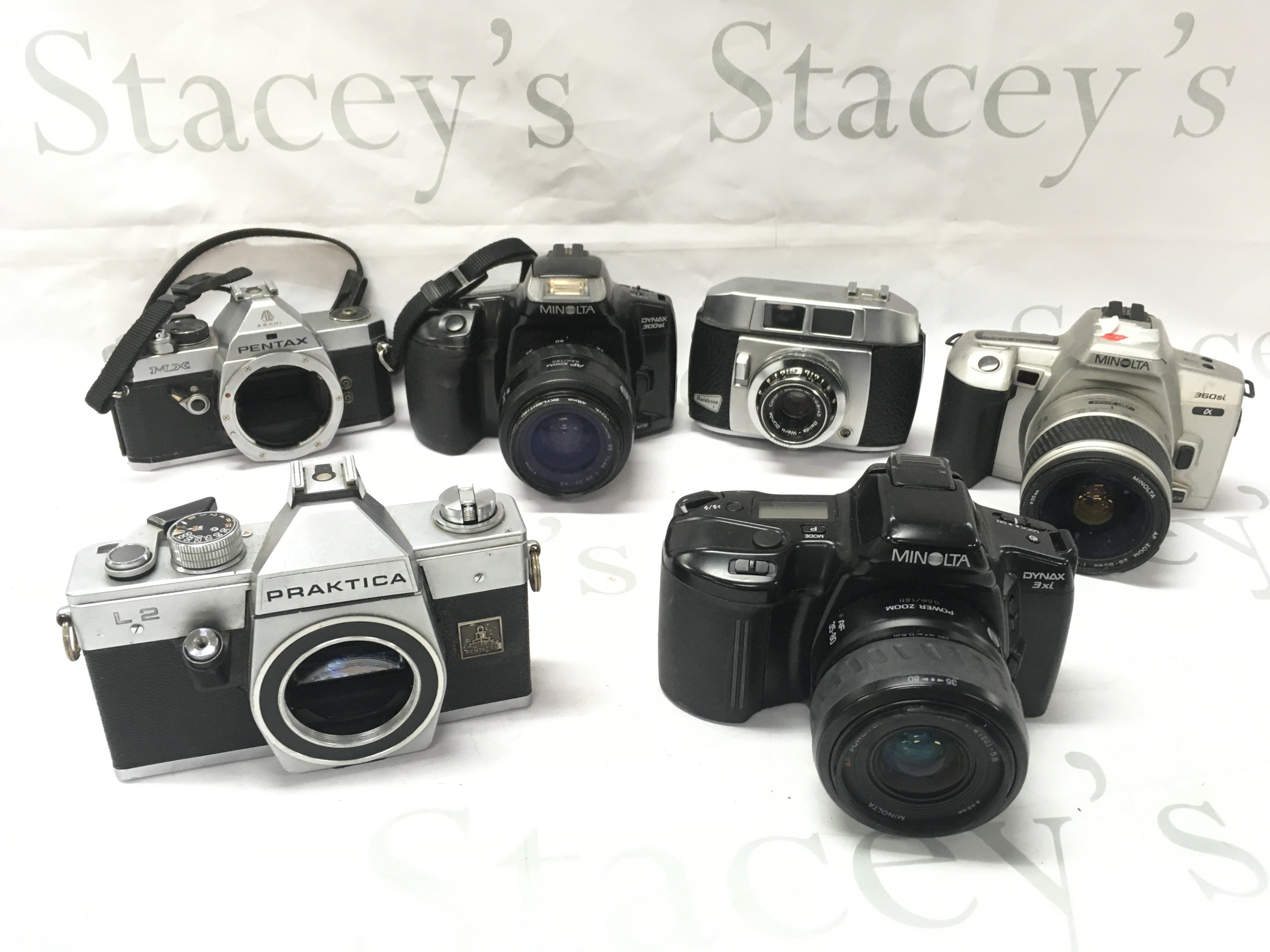 Various vintage cameras including Minolta 360si, Baldessa I, Minolta Dynax 300si, Pentax MX, Praktica L2. Postage category C