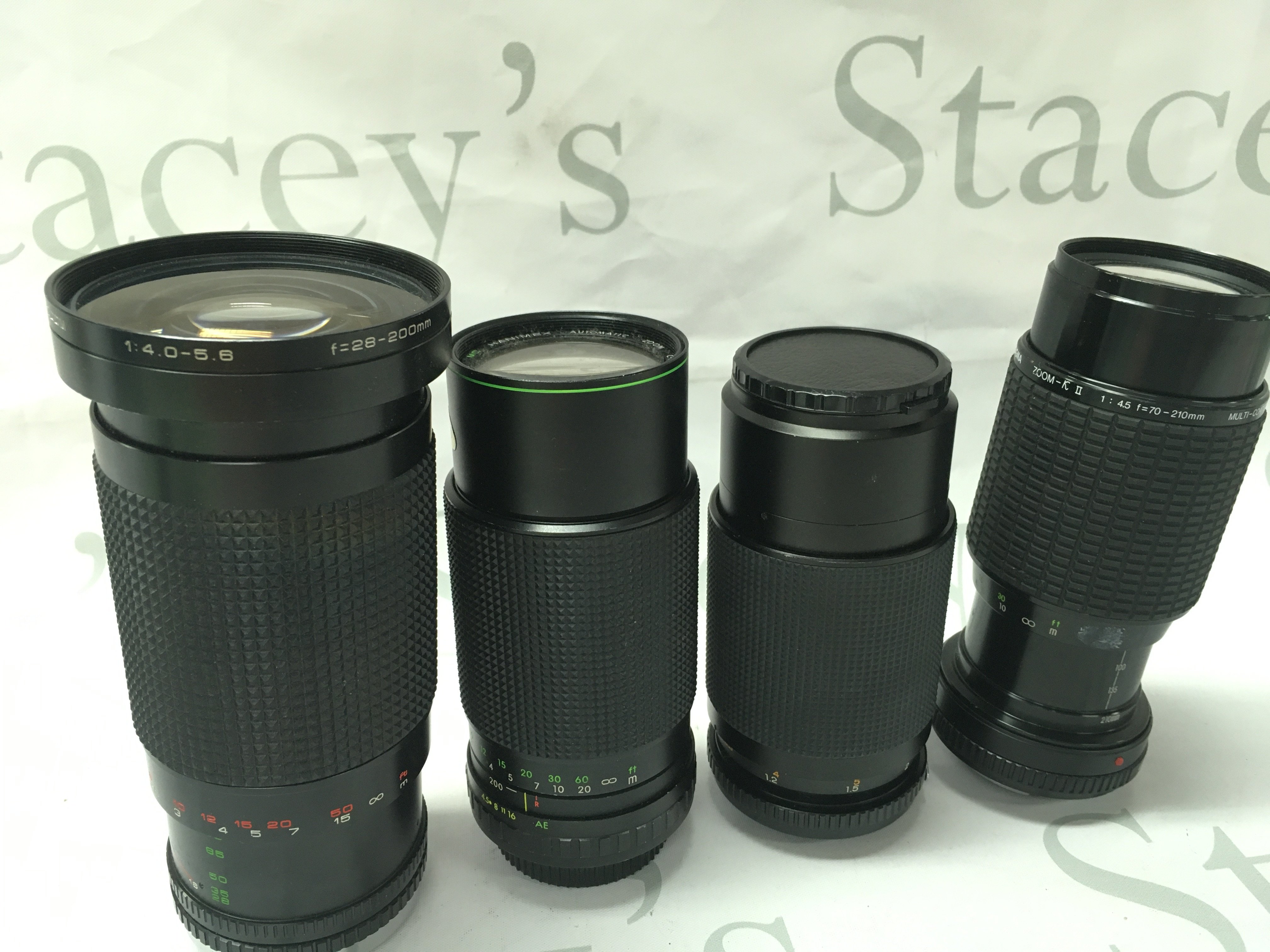 Four vintage cameras lenses- Sigma 210mm, MC Cimko 200mm, Hanimex 200mm, Sirius 200mm