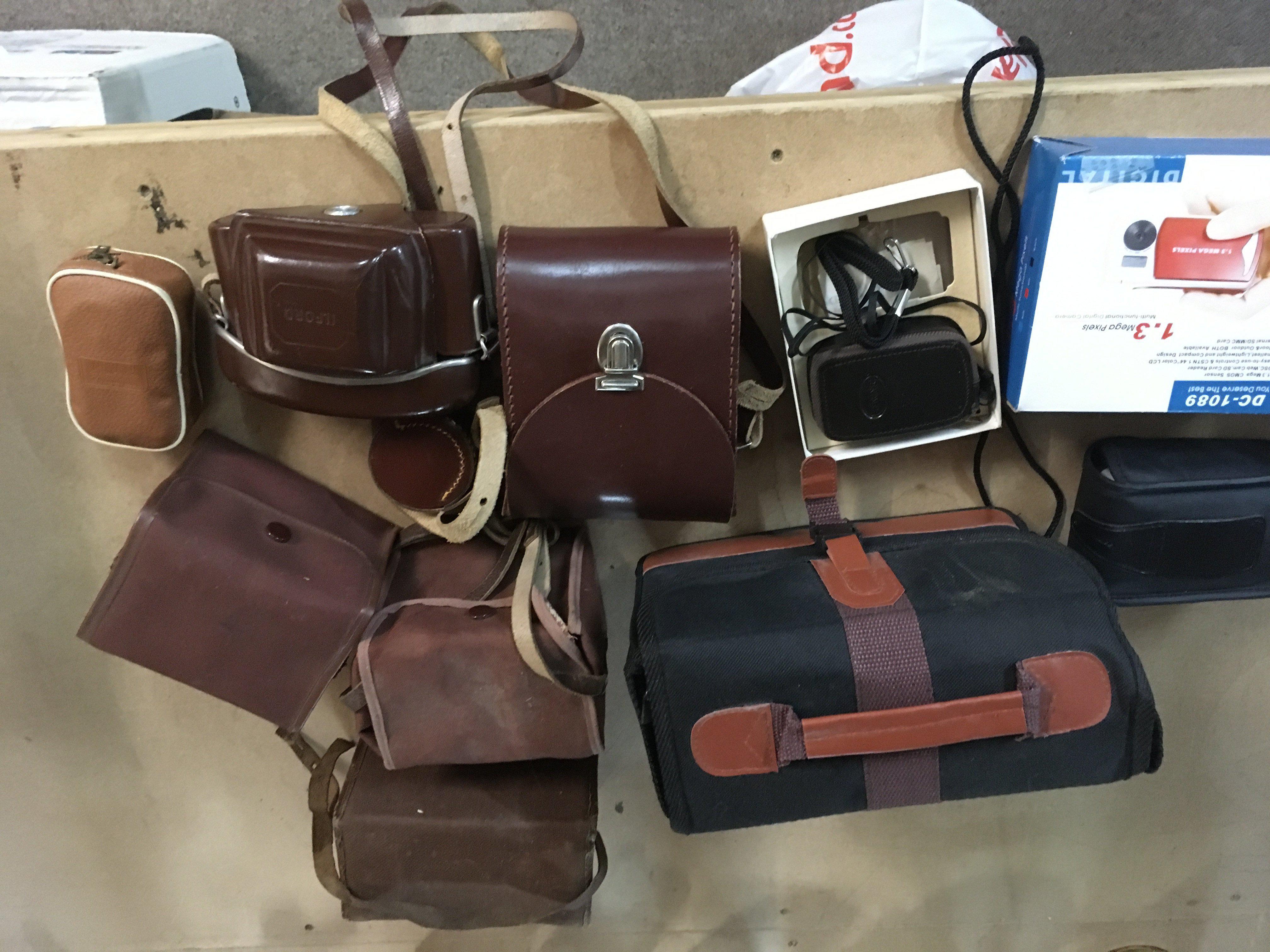 A box containing various cameras and equipment.