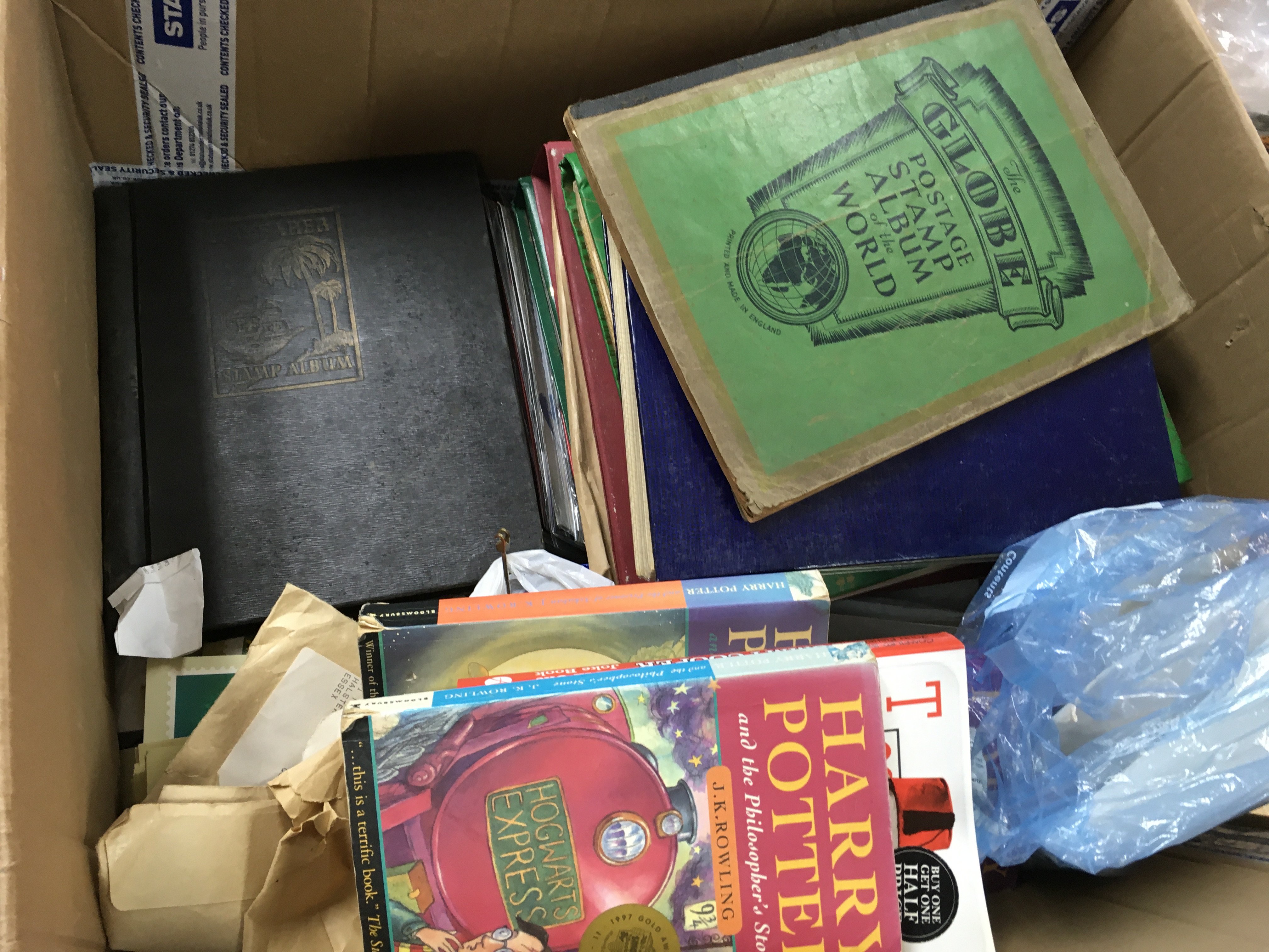 A collection of various 20th century used and unused world stamps , first day covers and books including Harry Potter . This lot cannot be posted