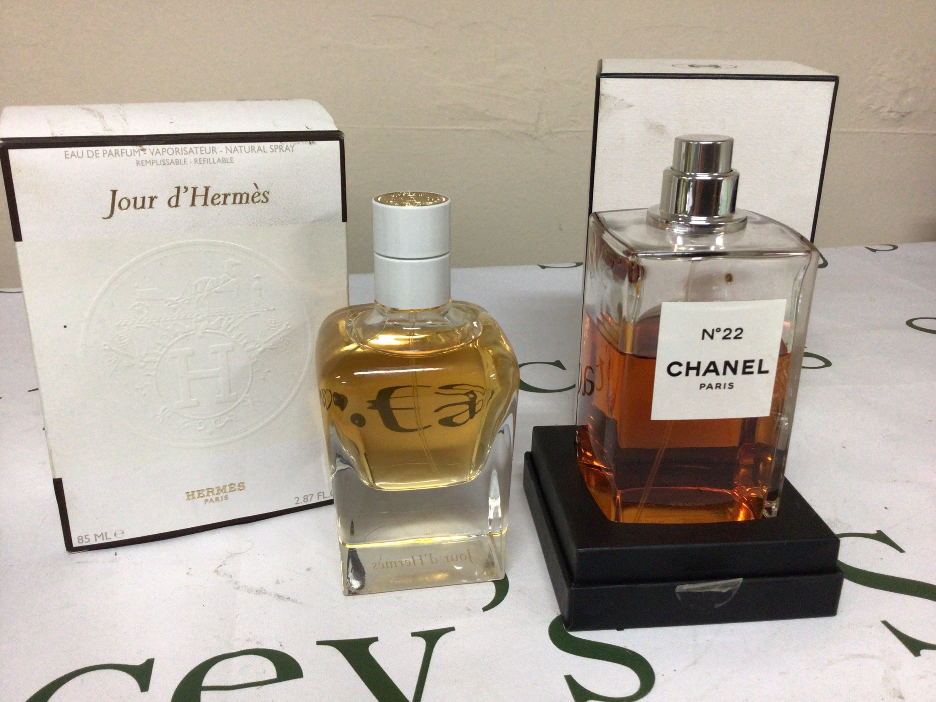 A Vintage bottle of 200ml Chanel No 22 perfume in a fitted box partly used and a bottle of Hermes Paris Perfume 85ml (2)