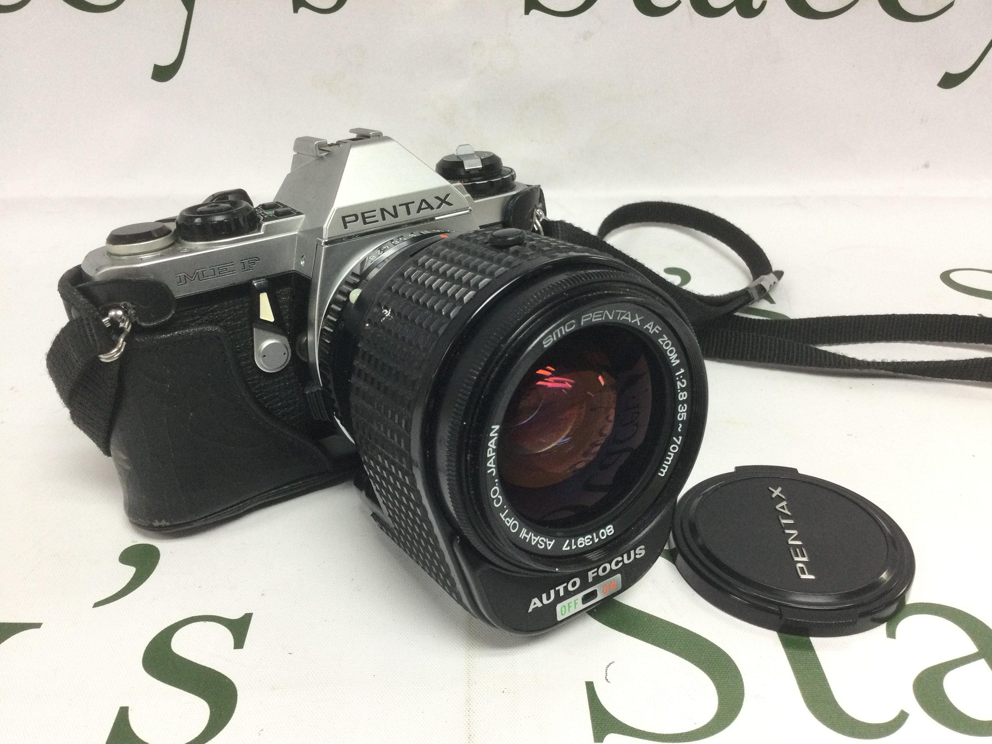 A Pentax camera with AF Zoom lens. Shipping category D.