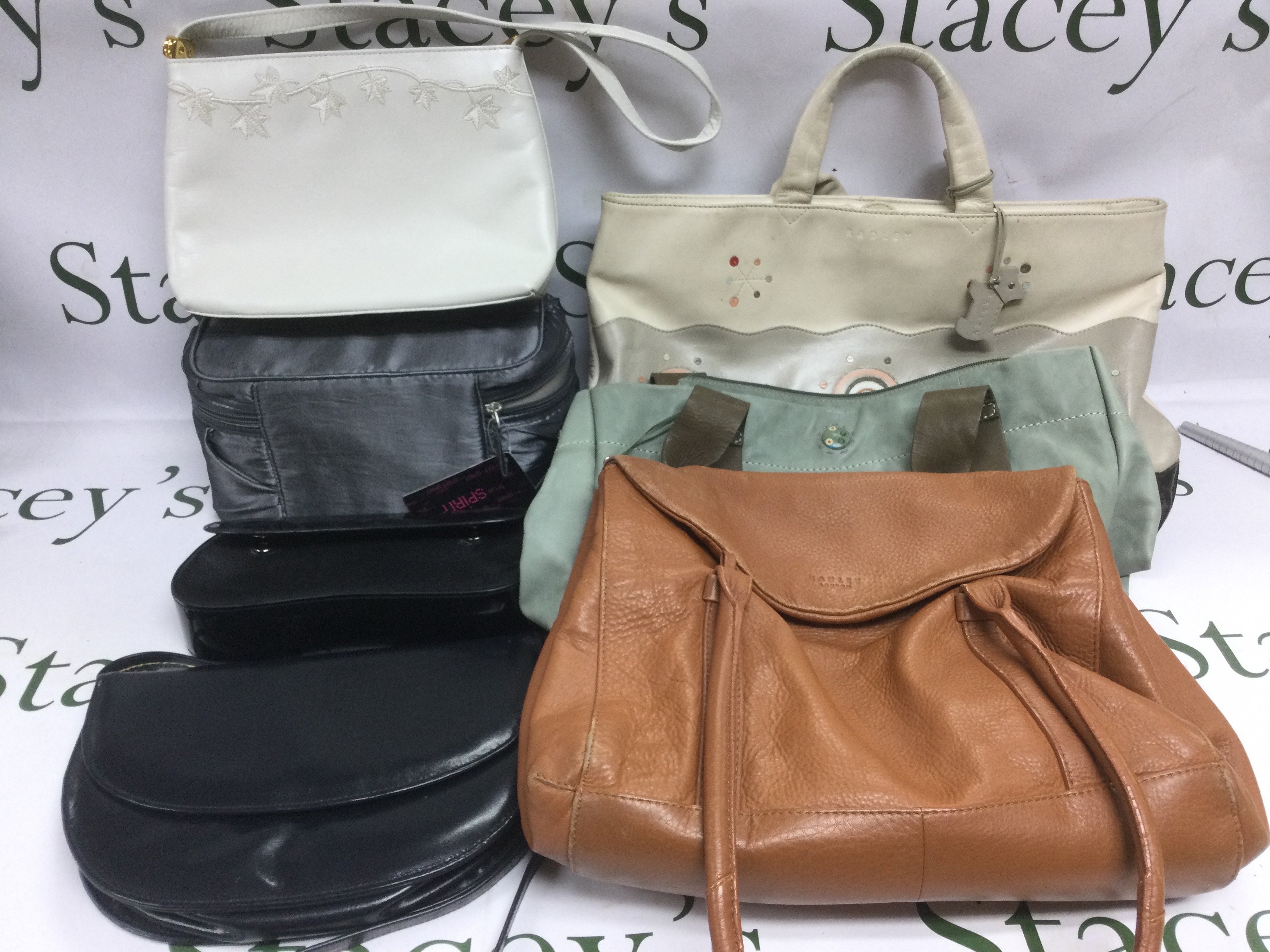 A collection of ladies handbags, clutch bags etc including three Radley examples. Shipping category C.