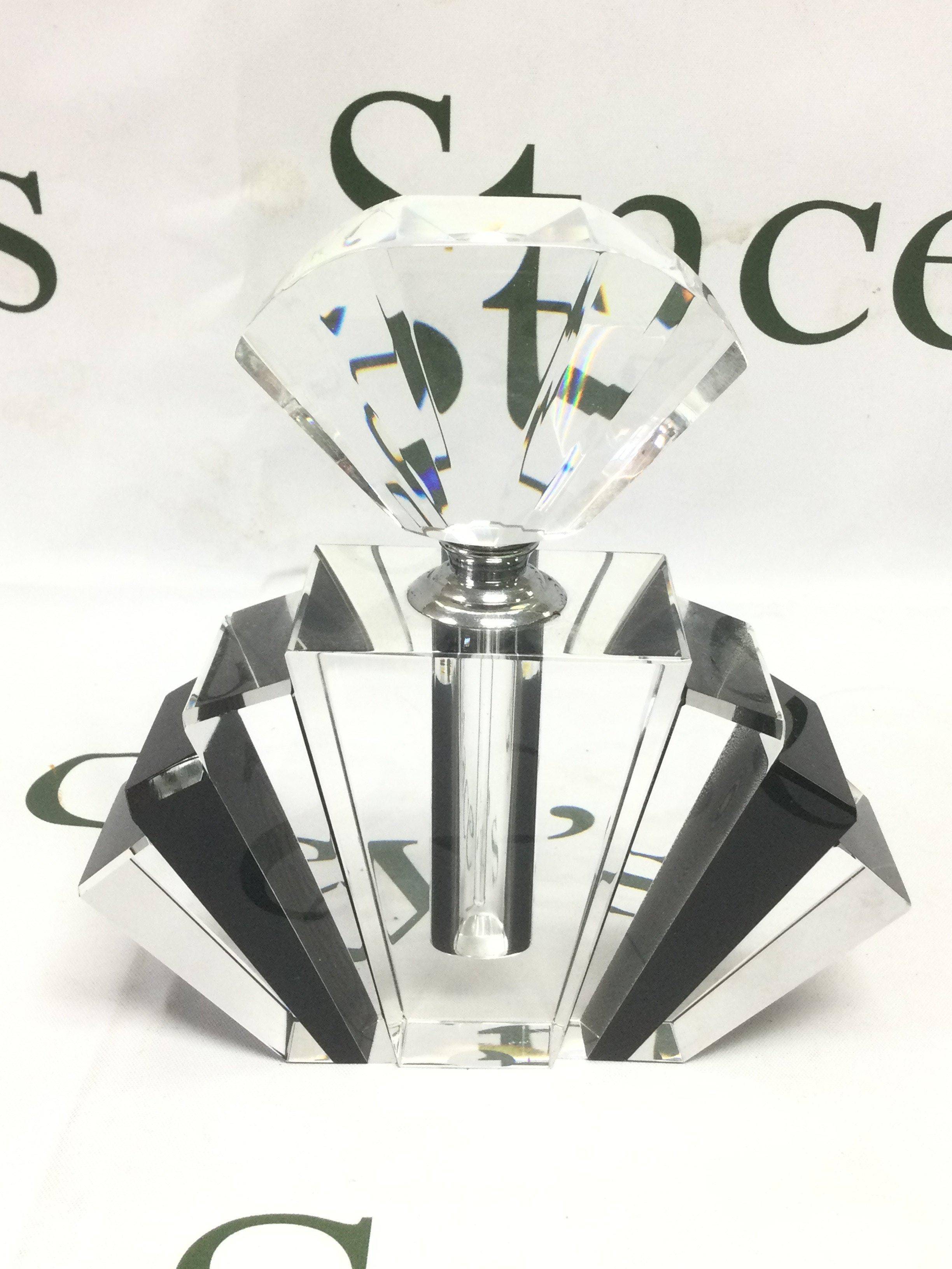 An Art Deco style perfume bottle in clear and black glass, approx height 16.5cm. Shipping category D.