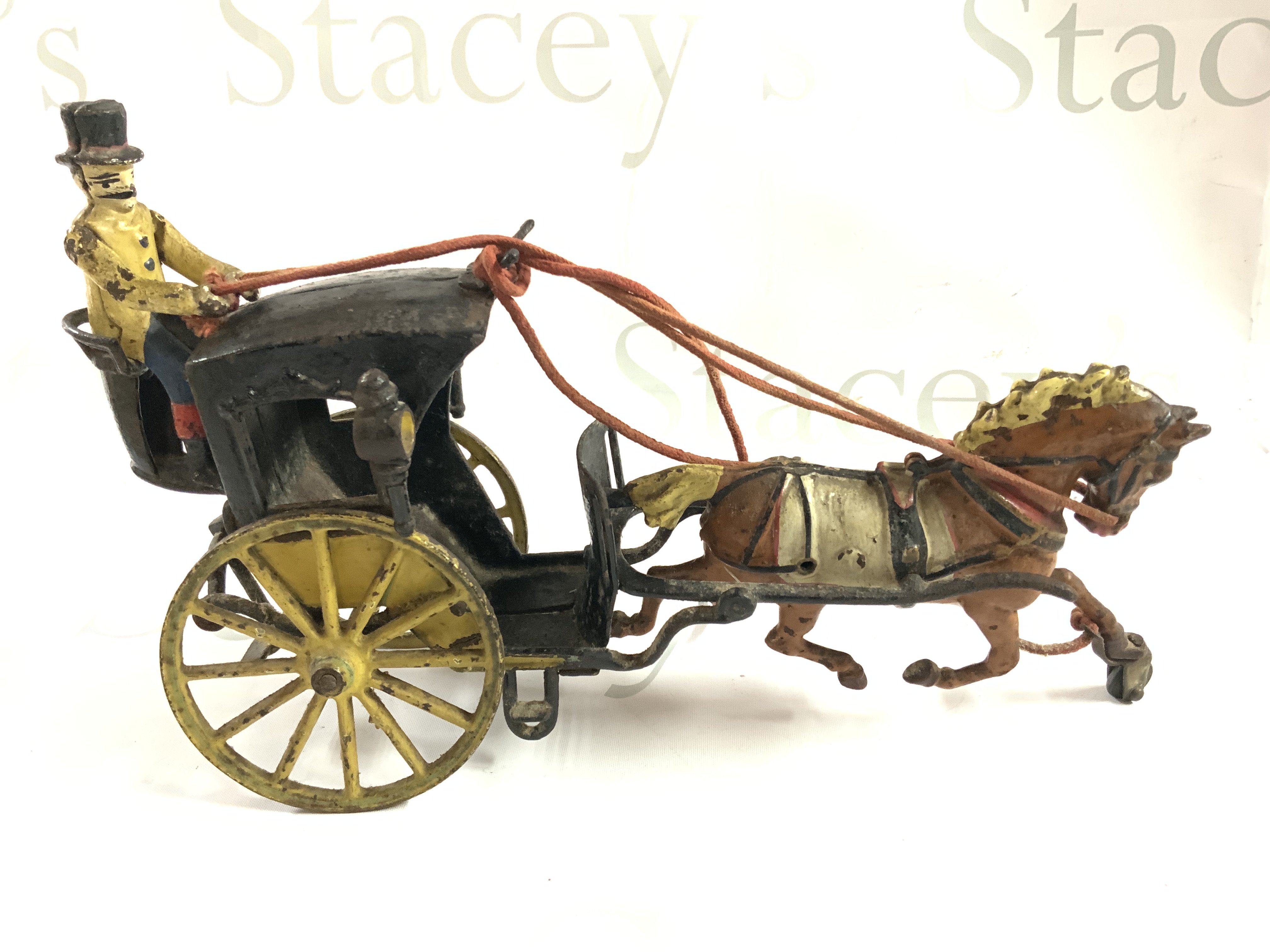 An Early cast iron horse drawn Hanson cab, original paintwork. 29cm. (C)
