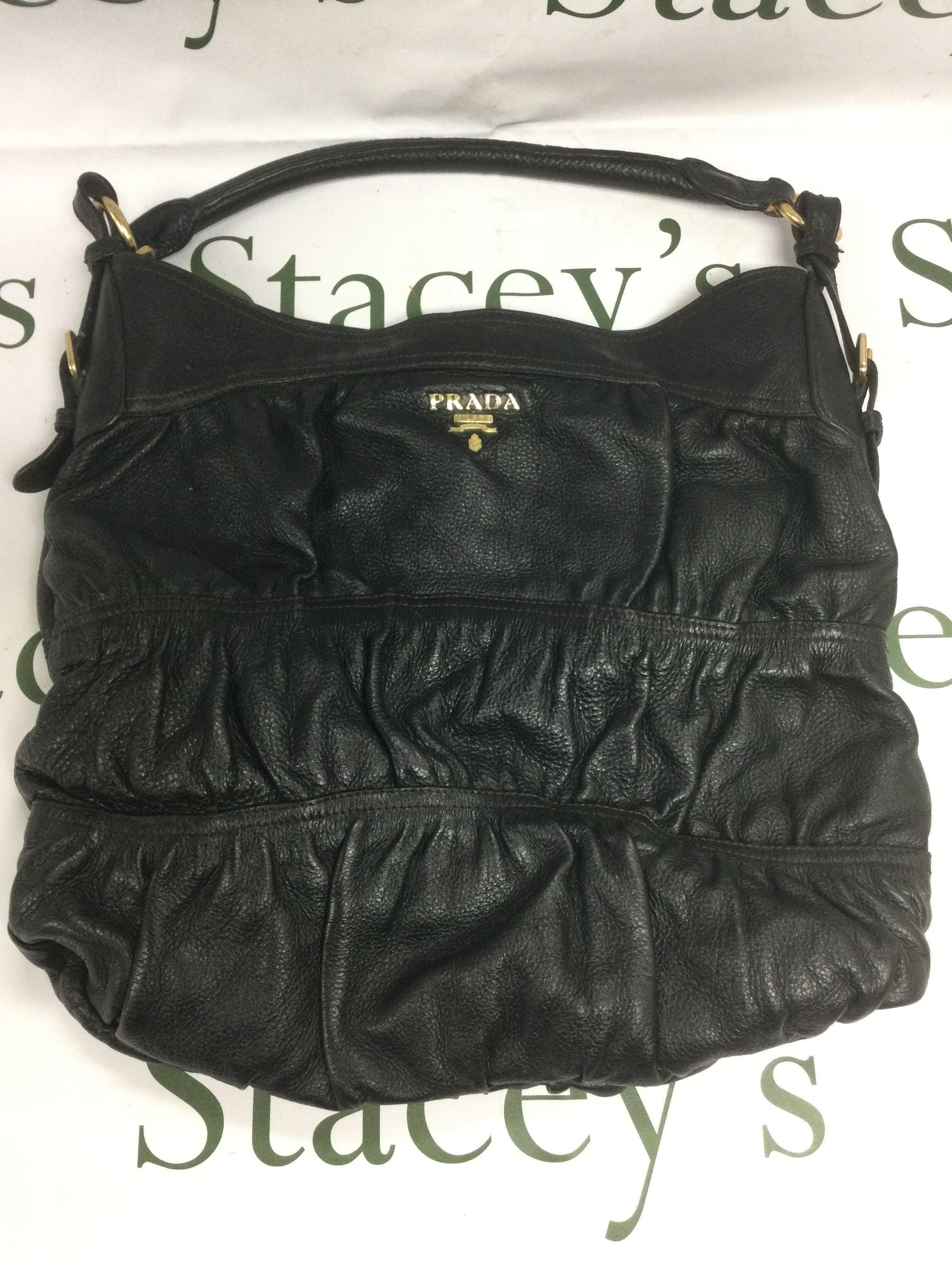 A Prada black leather shoulder bag. Shipping category B.