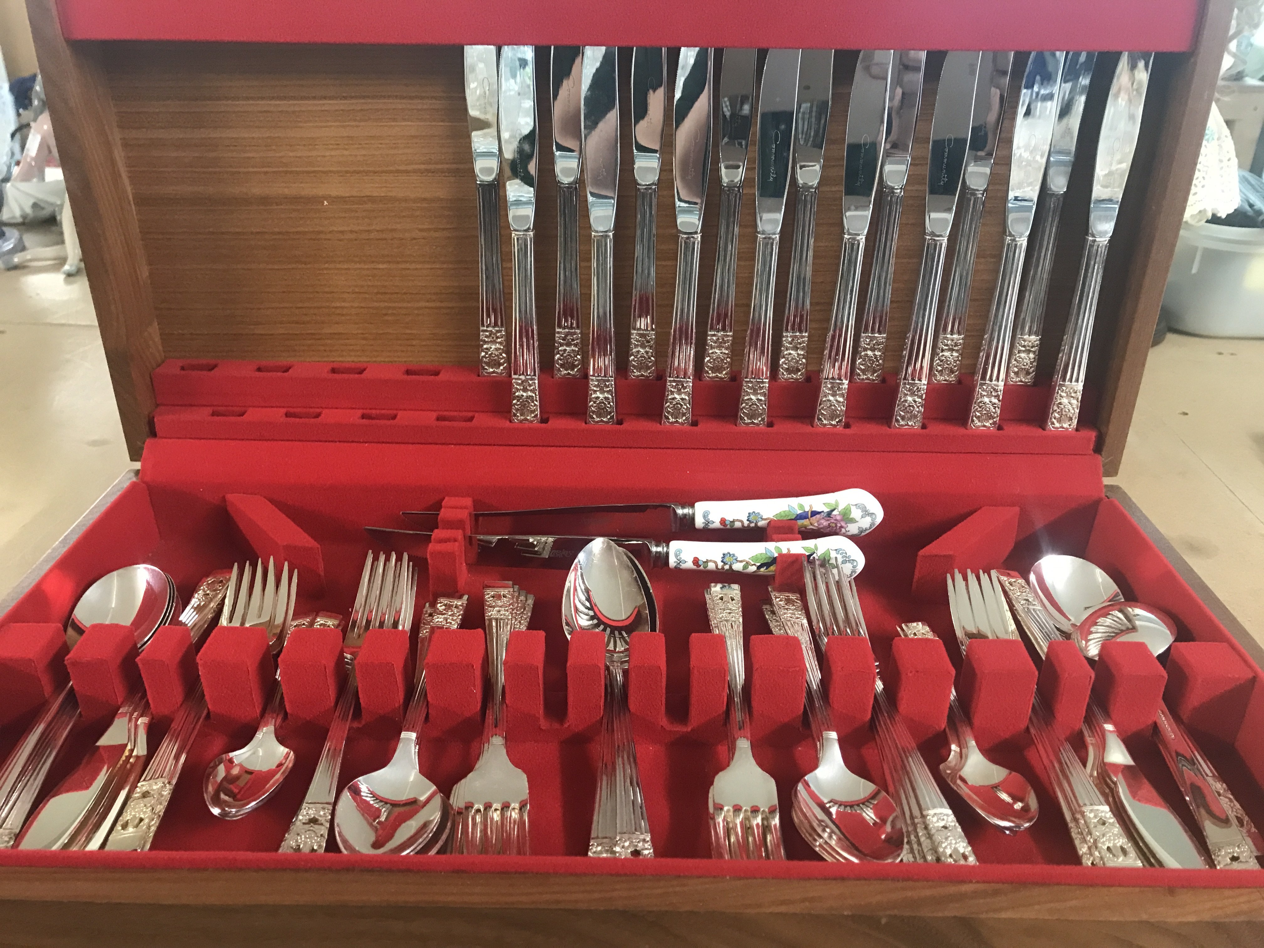 A community cutlery set together with two Aynsley knives and cased knives and spoons.