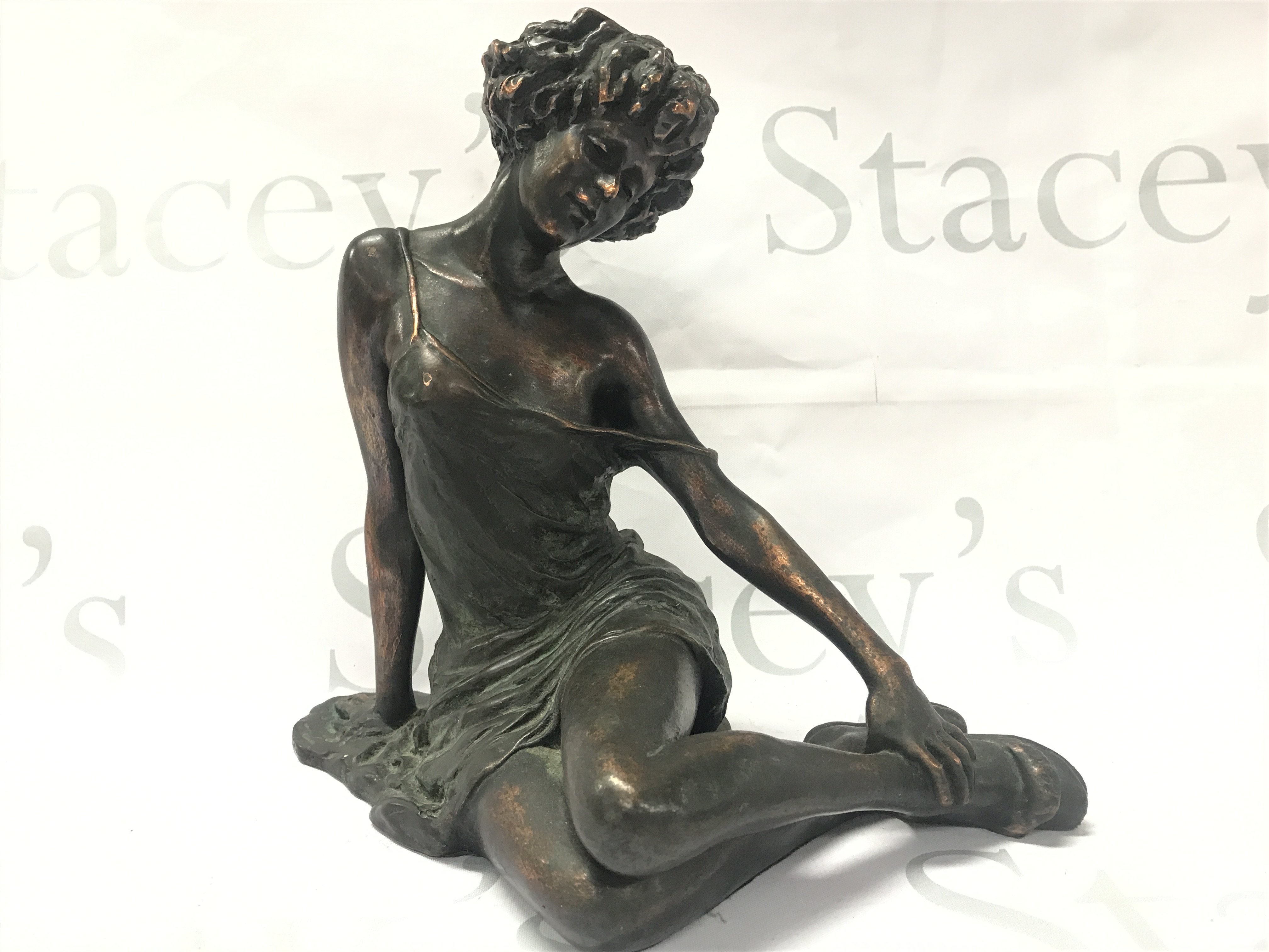 A cold composition bronze classical figure of a seated woman , signed .24cm tall. Postage category B