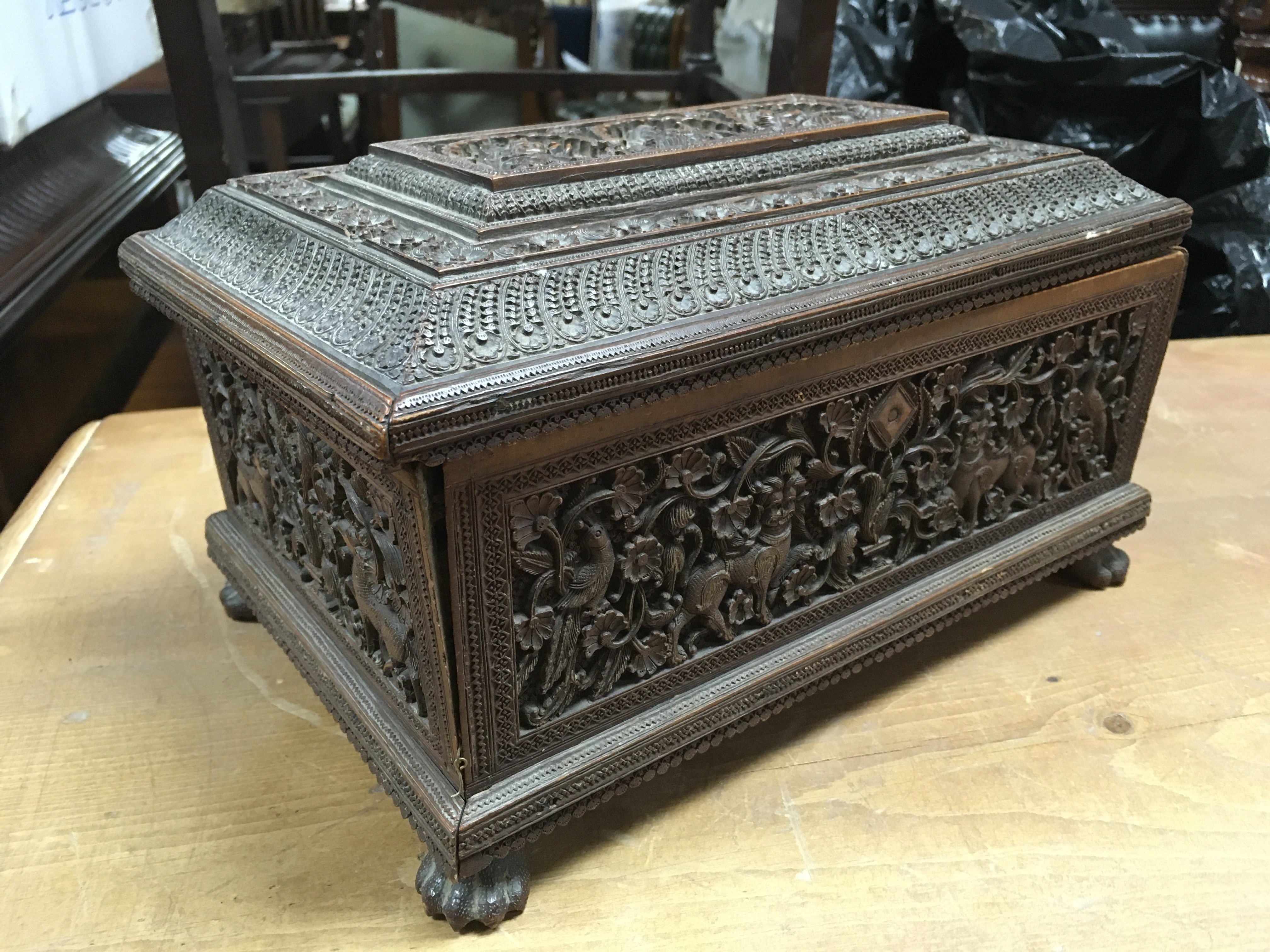 A carved ornate Sandalwood box with inner compartments. Dimensions 26x16x17cm . Postage category B