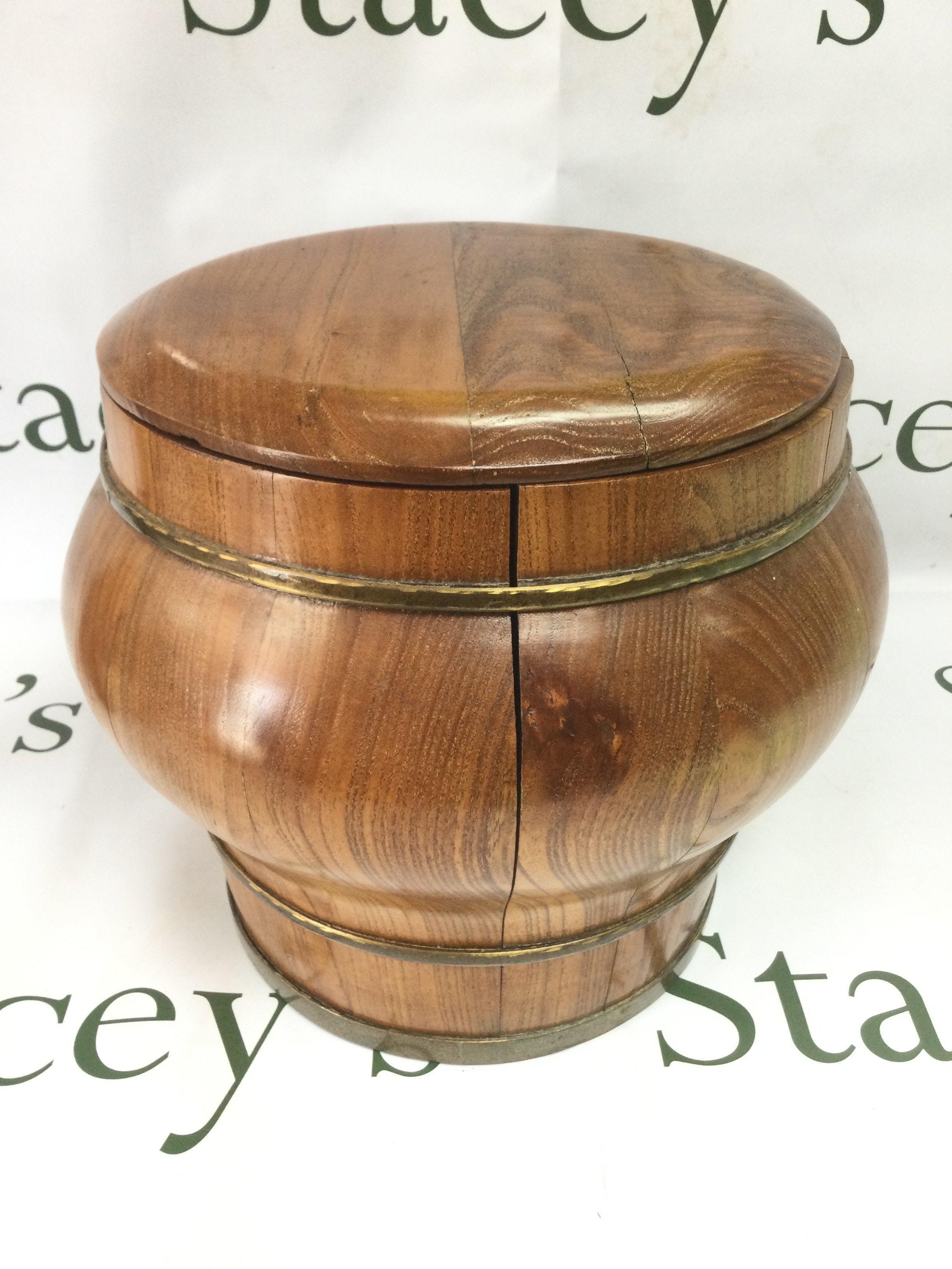 An early 20th Century Chinese wooden rice bucket, approx height 25cm. Shipping category D.