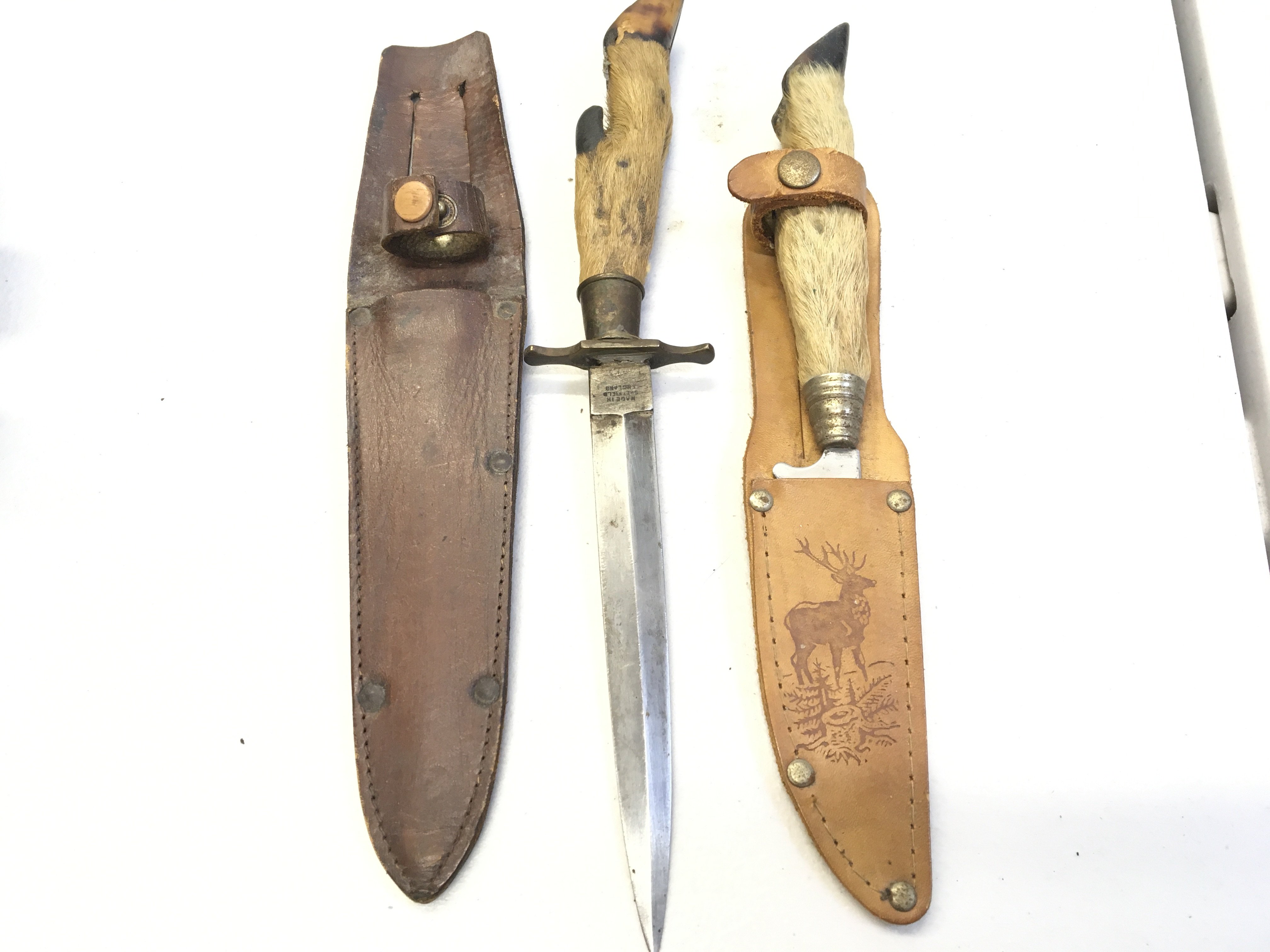 A Vintage Hunting Knife possibly the steel blade with maker William Hodgers England with a deer hoof grip and one other conforming hunting knife (2)