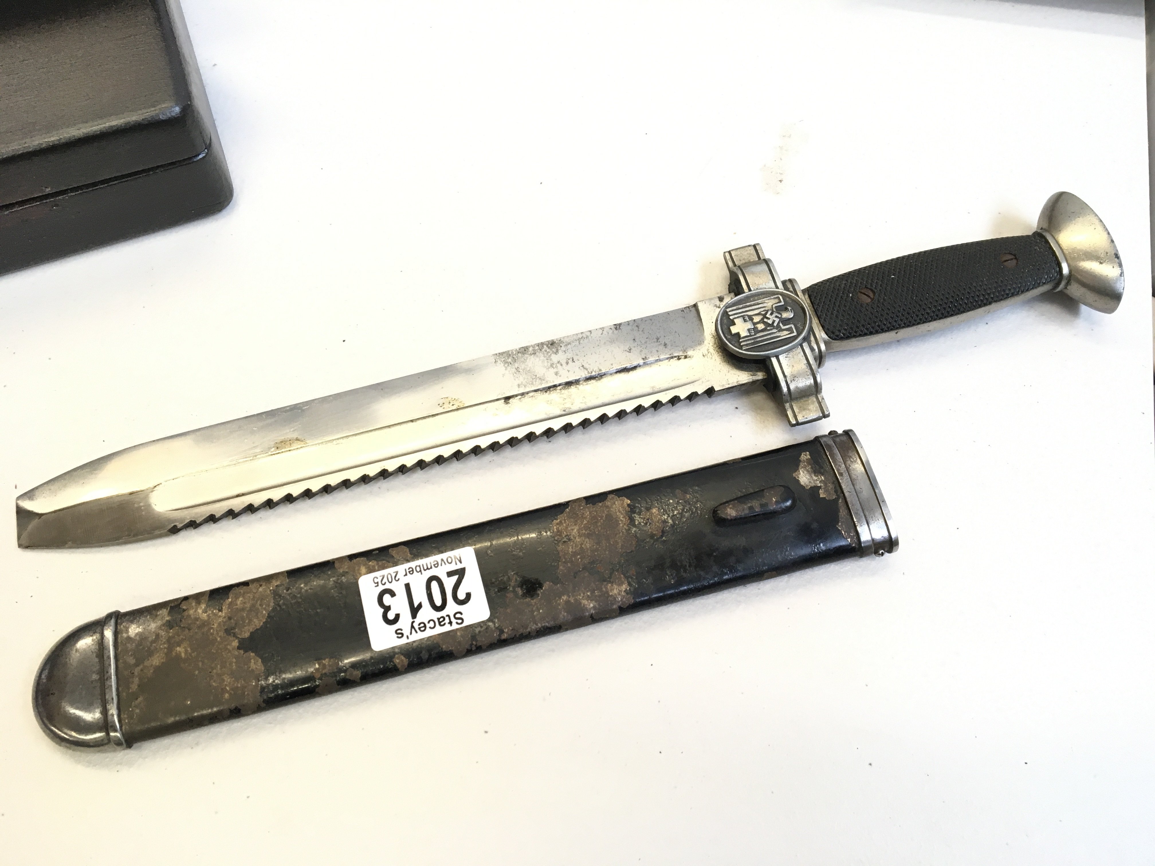 A Rare German Third Reich II world war dagger with saw edge blade The DRK Red Cross Hewer. All original condition with makers stamp under the eagle cross bar.